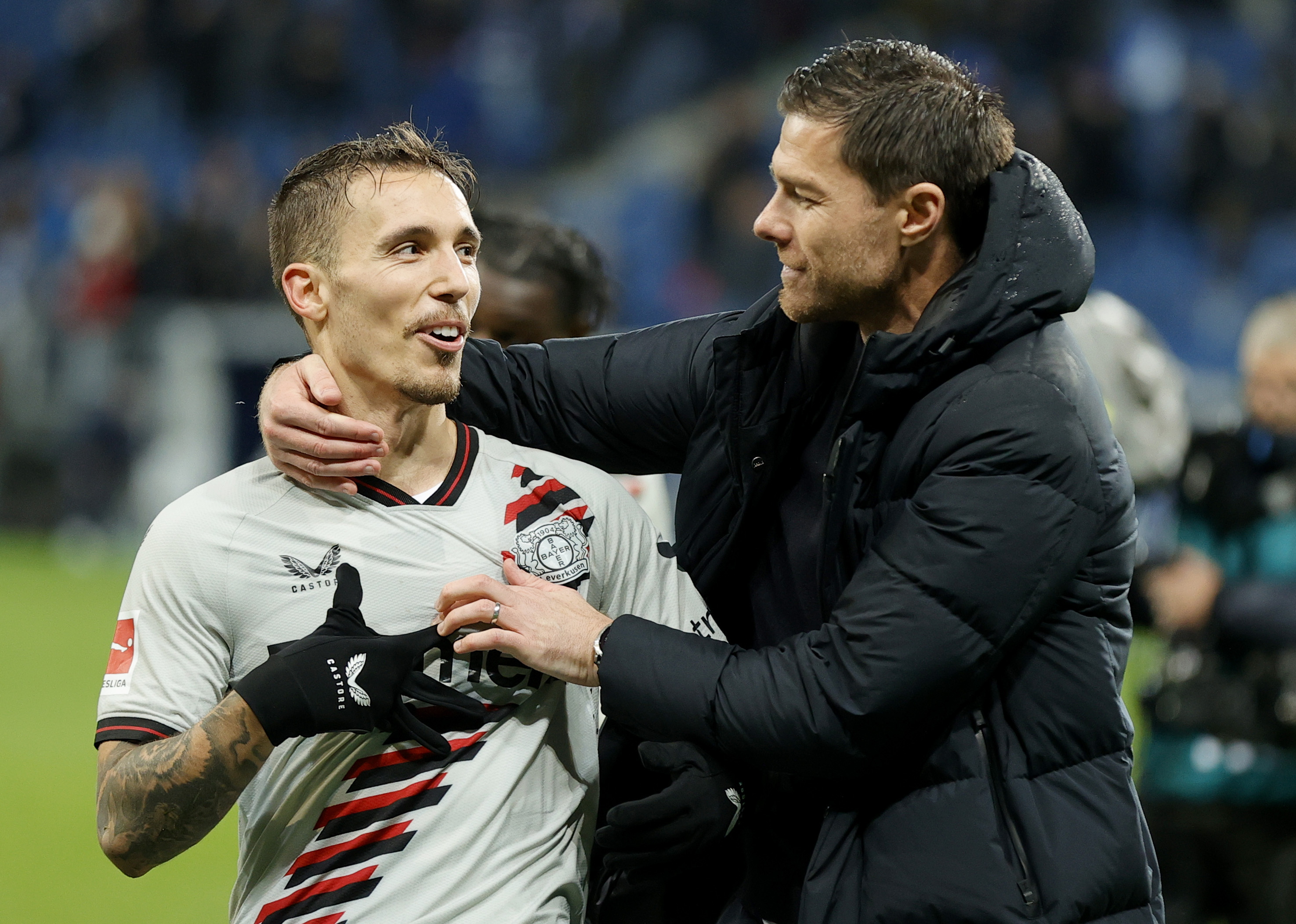 Sinsheim (Germany), 04/11/2023.- Leverkusen's head coach Xabi Alonso (R) and player Alejandro Grimaldo celebrate after winning the German Bundesliga soccer match between TSG 1899 Hoffenheim and Bayer 04 Leverkusen in Sinsheim, Germany, 04 November 2023. (Alemania) EFE/EPA/RONALD WITTEK CONDITIONS - ATTENTION: The DFL regulations prohibit any use of photographs as image sequences and/or quasi-video.