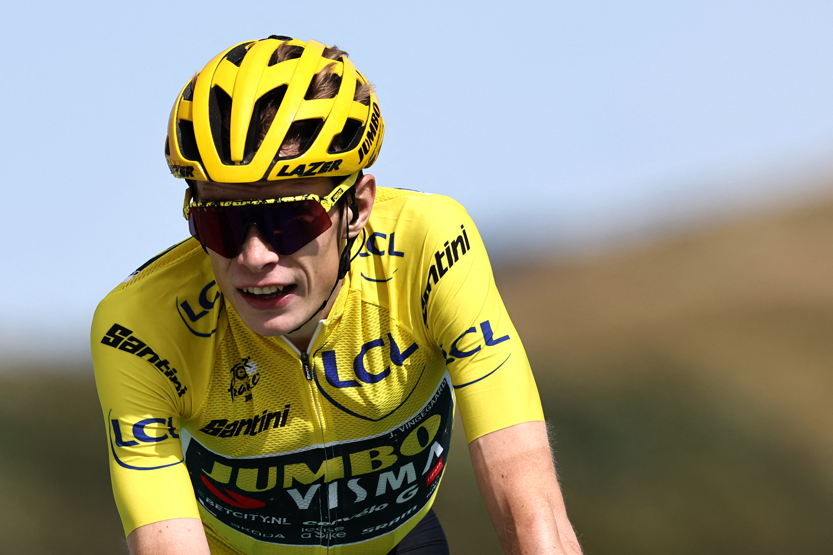 (FILES) Jumbo-Visma's Danish rider Jonas Vingegaard wearing the overall leader's yellow jersey crosses the finish line at the end of the 20th stage of the 110th edition of the Tour de France cycling race 133 km between Belfort and Le Markstein Fellering, in Eastern France, on July 22, 2023.