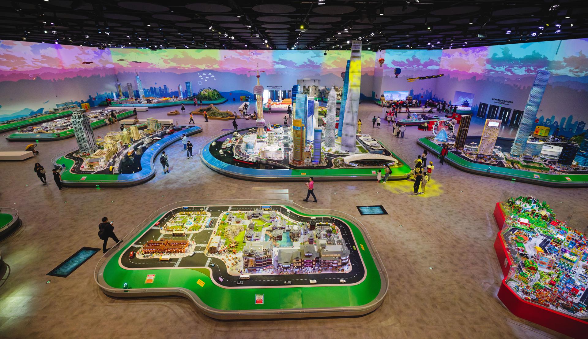 Shanghai (China), 20/06/2025.- Visitors walk amongst Lego models of Shanghai city during the press day in the new Legoland in Shanghai, China, 20 June 2025. The Legoland Shanghai Resort will open on 05 July 2025. As the world's largest Legoland, it will include eight themed lands, over 75 interactive attractions, and a 250-room Lego-themed hotel. EFE/EPA/ALEX PLAVEVSKI