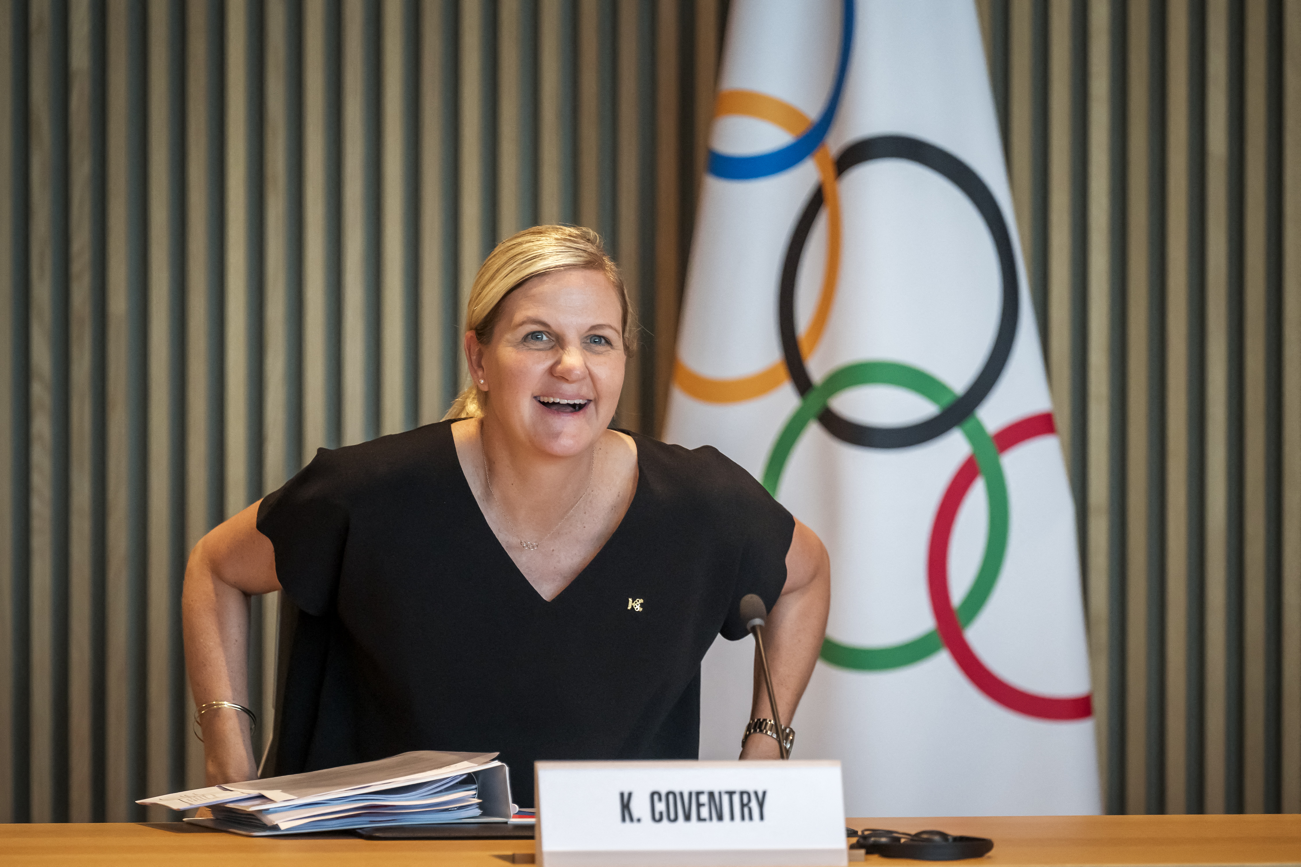 President of the International Olympic Committee Kirsty Coventry smiles seating or her first meeting of the International Olympic Committee (IOC) executive commission as IOC president, at Olympic House in Lausanne, on June 25, 2025.