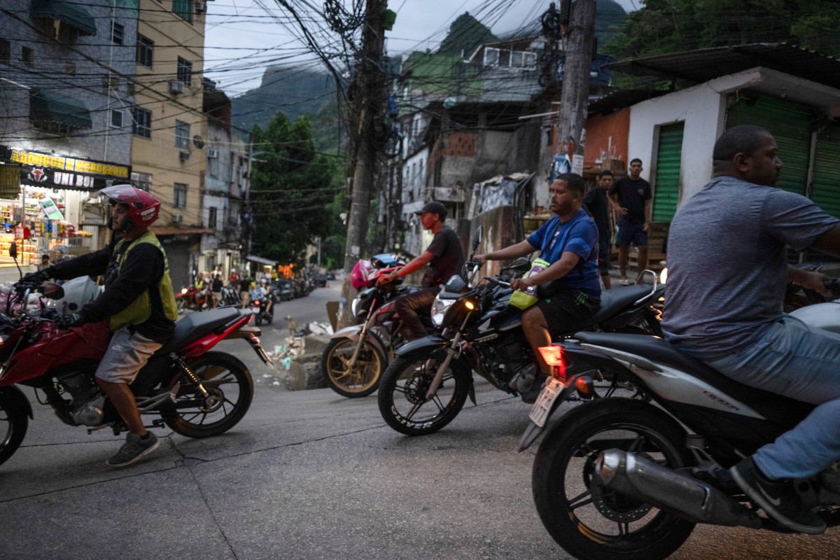 Motorcyclists ride through the Rocinha favela in Rio de Janeiro, Brazil, on March 5, 2026.