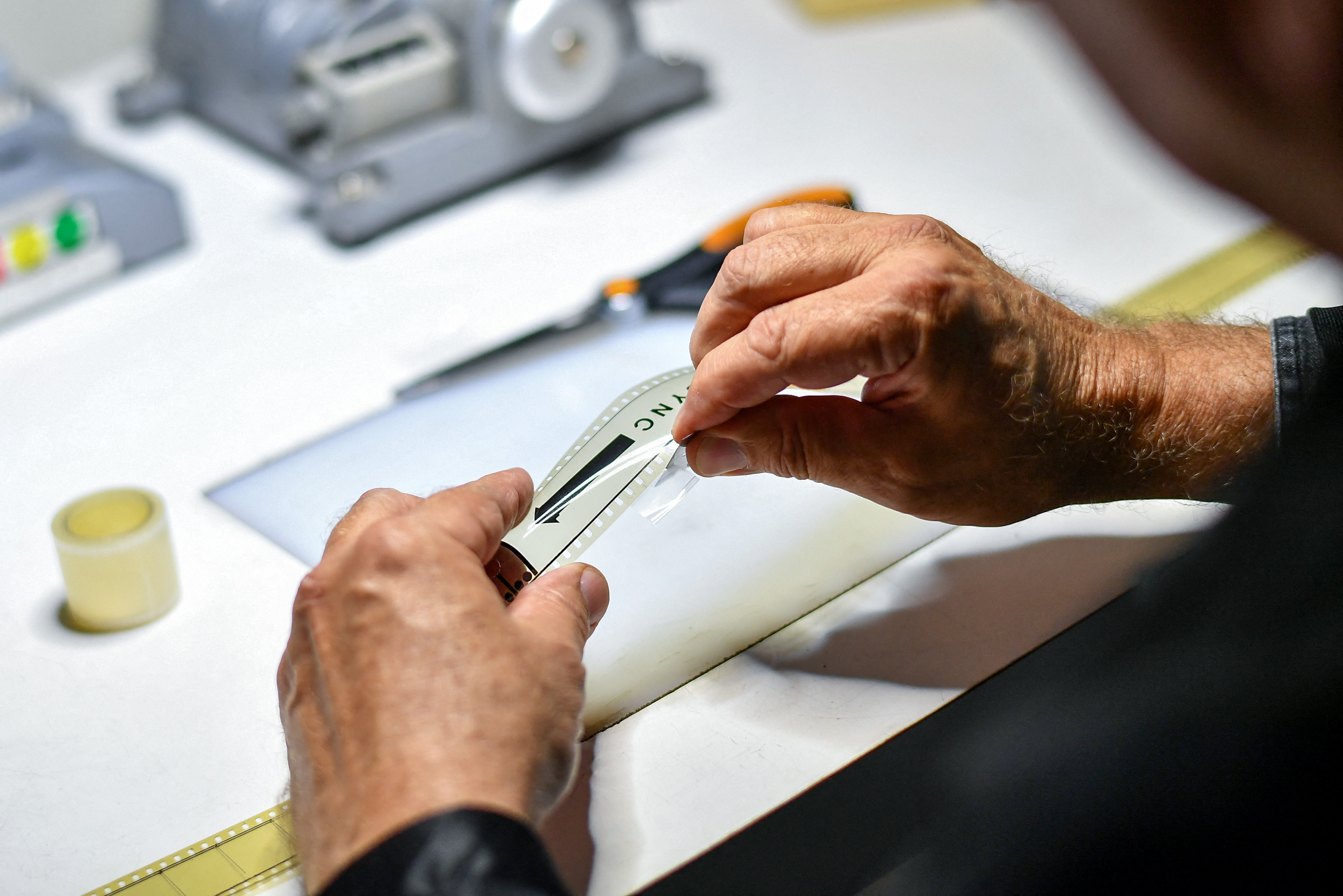 A film specialist checks film and writes recommendations to the clients about actions to keep the film in a good shape at Pro-Tek Vaults on May 7, 2024 in Burbank, California.