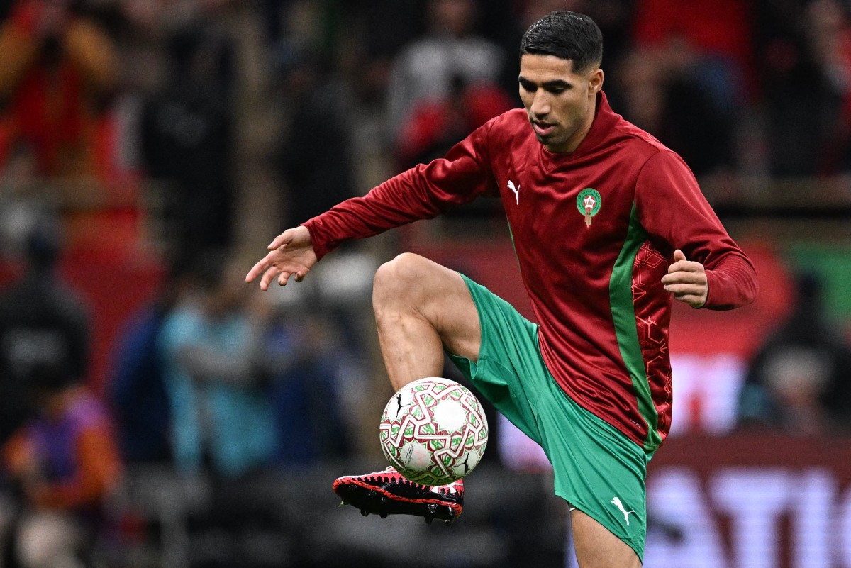 Morocco's defender #02 Achraf Hakimi warms-up before the Africa Cup of Nations (CAN) quarter-final football match between Cameroon and Morocco at the Prince Moulay Abdallah stadium in Rabat on January 9, 2026.