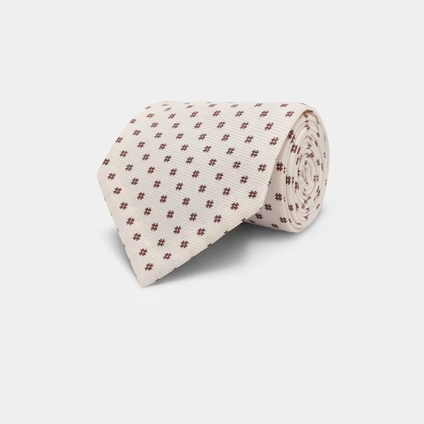 Corbata floreada color crudo