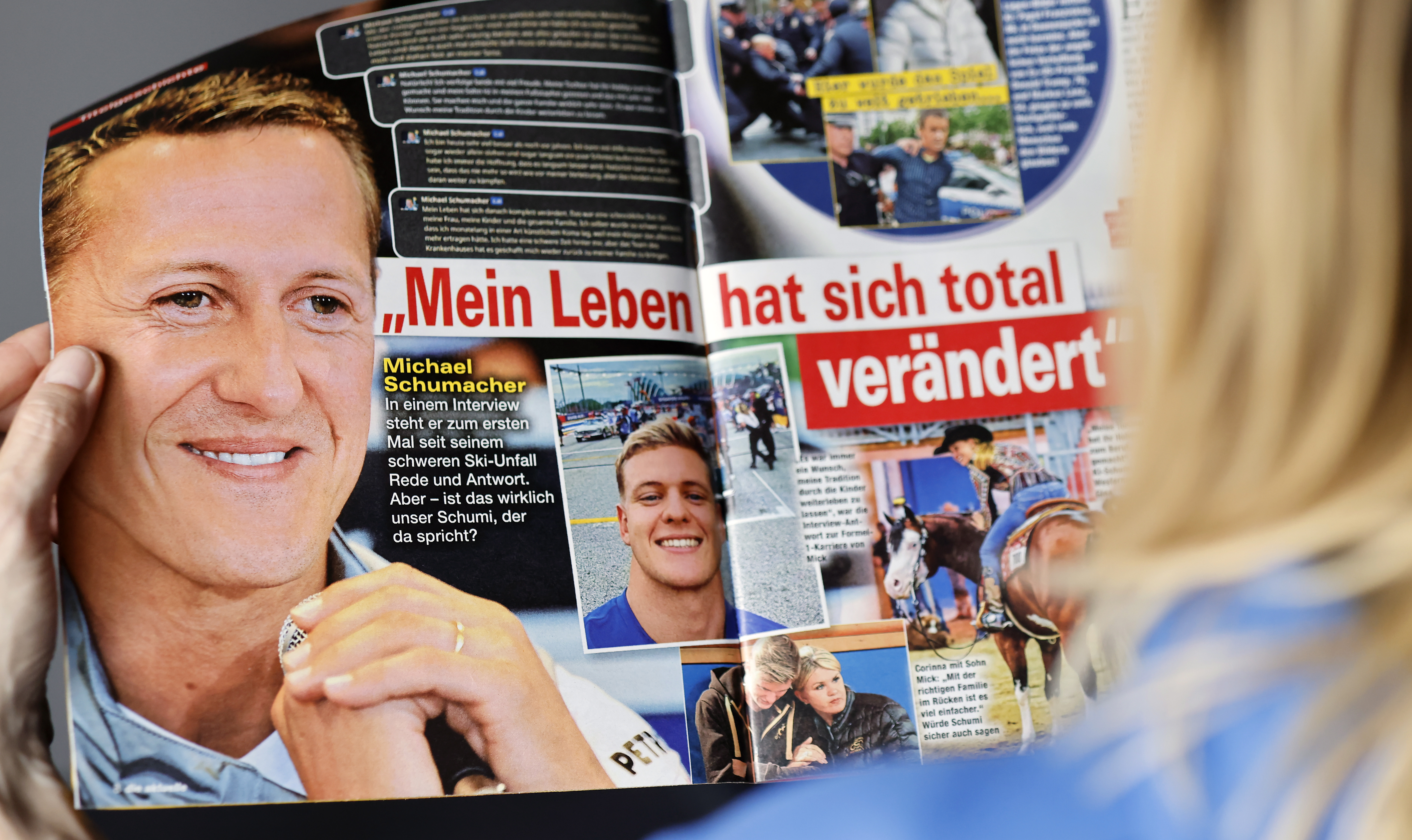 Berlin (Germany), 20/04/2023.- A woman reads the edition of German weekly magazine Die Aktuelle with the cover announcing a fake interview with Michael Schumacher, in Berlin, Germany, 20 April 2023. A spokesperson for the Schumacher family announced to take legal actions against the magazine that runs their cover with a story with a picture of Schumacher and under the headline "Michael Schumacher, the first interview" which was generated by an artificial intelligence (AI) chatbot. Formula One legend Schumacher retreated from public life following a skiing accident in the French Alps in 2013 and his family has remained protective of his privacy. (Fórmula Uno, Alemania) EFE/EPA/HANNIBAL HANSCHKE