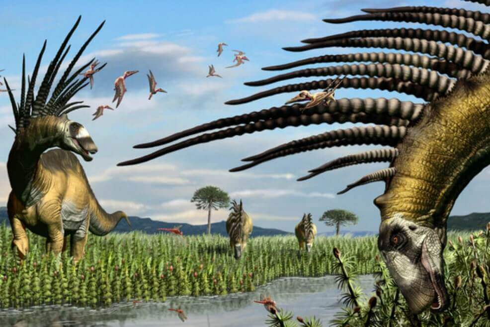 Un grupo de bajadasaurios a la vera de un curso de agua, en una vasta pradera de equisetos. Ilustración del paleoartista Jorge A. González. / Agencia Sinc/ imagen de referencia.