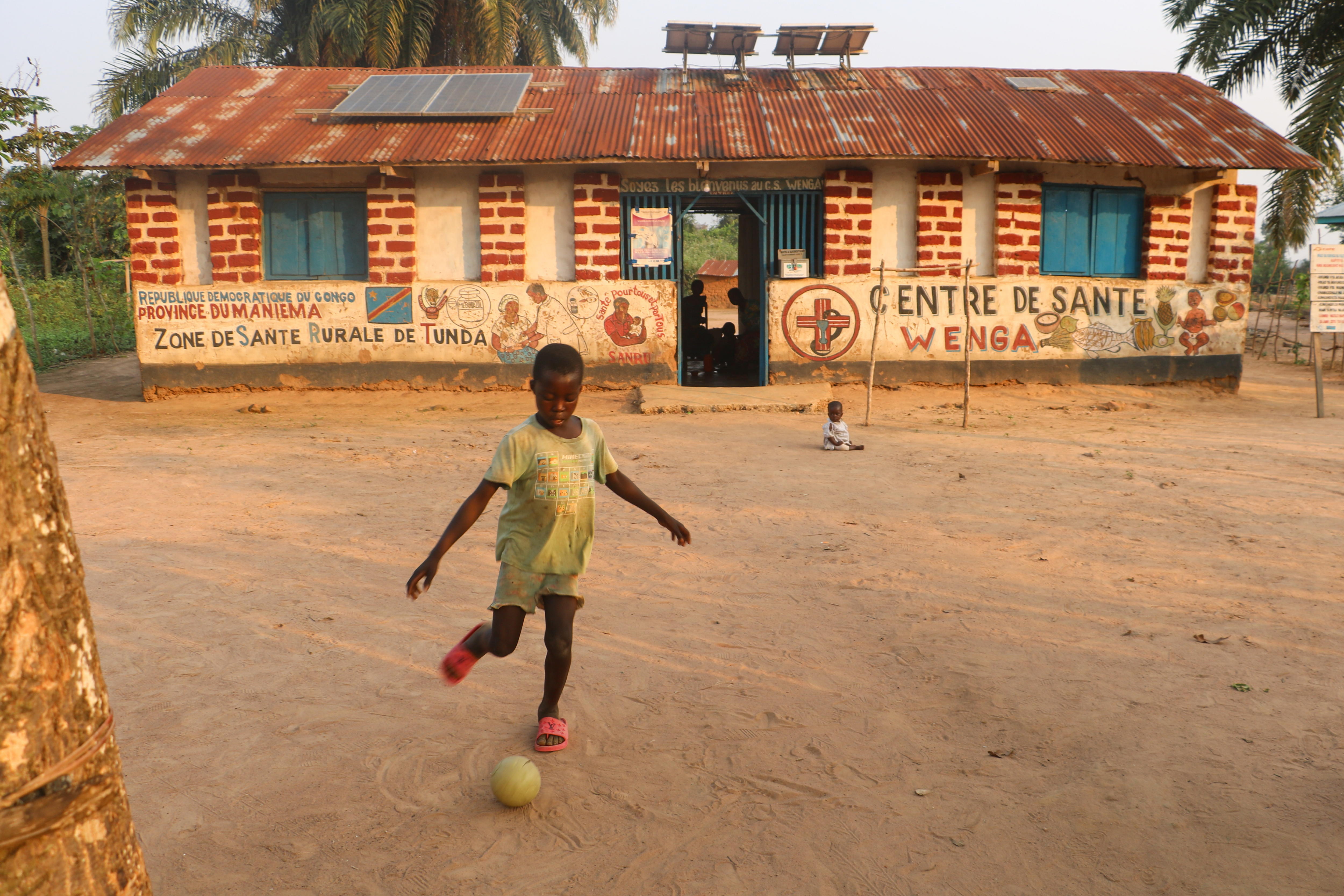 Wenga (Democratic Republic Of Congo), 19/08/2024.- A child plays football outside the Wenga Health Centre in Wenga, Democratic Republic of Congo, 19 August 2024 (issued 20 August 2024). Democratic Republic of Congo'Äôs Health Minister Samuel-Boger Kamba said the death toll due to the mpox outbreak now stands at 'a little more than 570 deaths.' EFE/EPA/CHADRACK LONDE