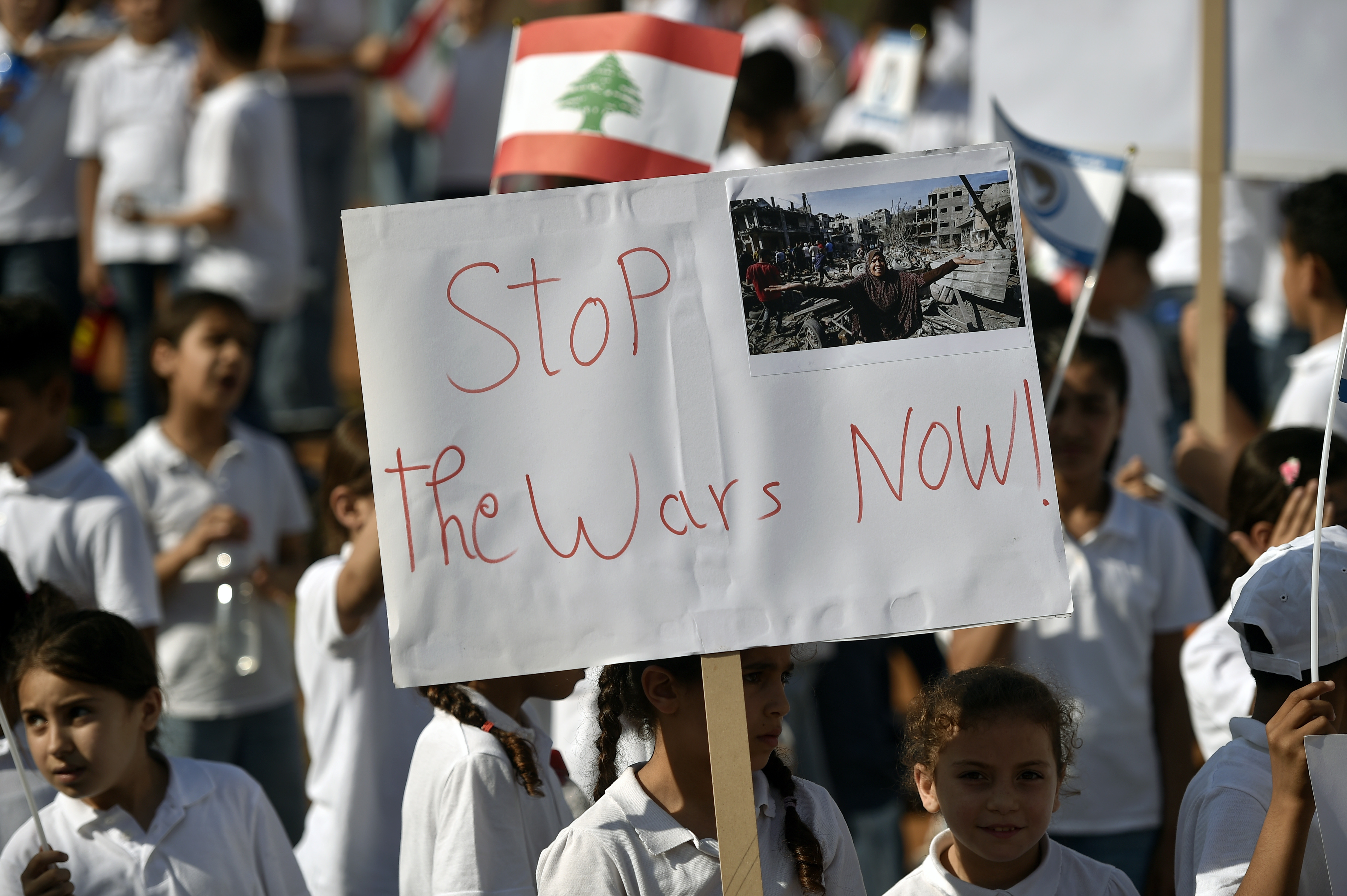 Beirut (Lebanon), 11/06/2024.- A child from 'Dar Al Aytam Al Islamiya' (Social Welfare Institutions) carries a placard during a protest in support of the children of Gaza and to demand an end to Israel's operations in Gaza organized by the Lebanese NGO Social Welfare Institutions outside the United Nations Economic and Social Commission for Western Asia (UN-ESCWA) headquarters in Beirut, Lebanon, 11 June 2024. More than 37,000 Palestinians and over 1,400 Israelis have been killed, according to the Palestinian Health Ministry and the Israel Defense Forces (IDF), since Hamas militants launched an attack against Israel from the Gaza Strip on 07 October 2023, and the Israeli operations in Gaza and the West Bank which followed it. (Protestas, Líbano) EFE/EPA/WAEL HAMZEH