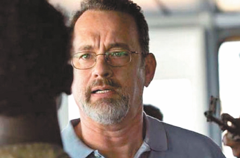 Tom Hanks (derecha) protagonizó la película “Capitán Phillips”.