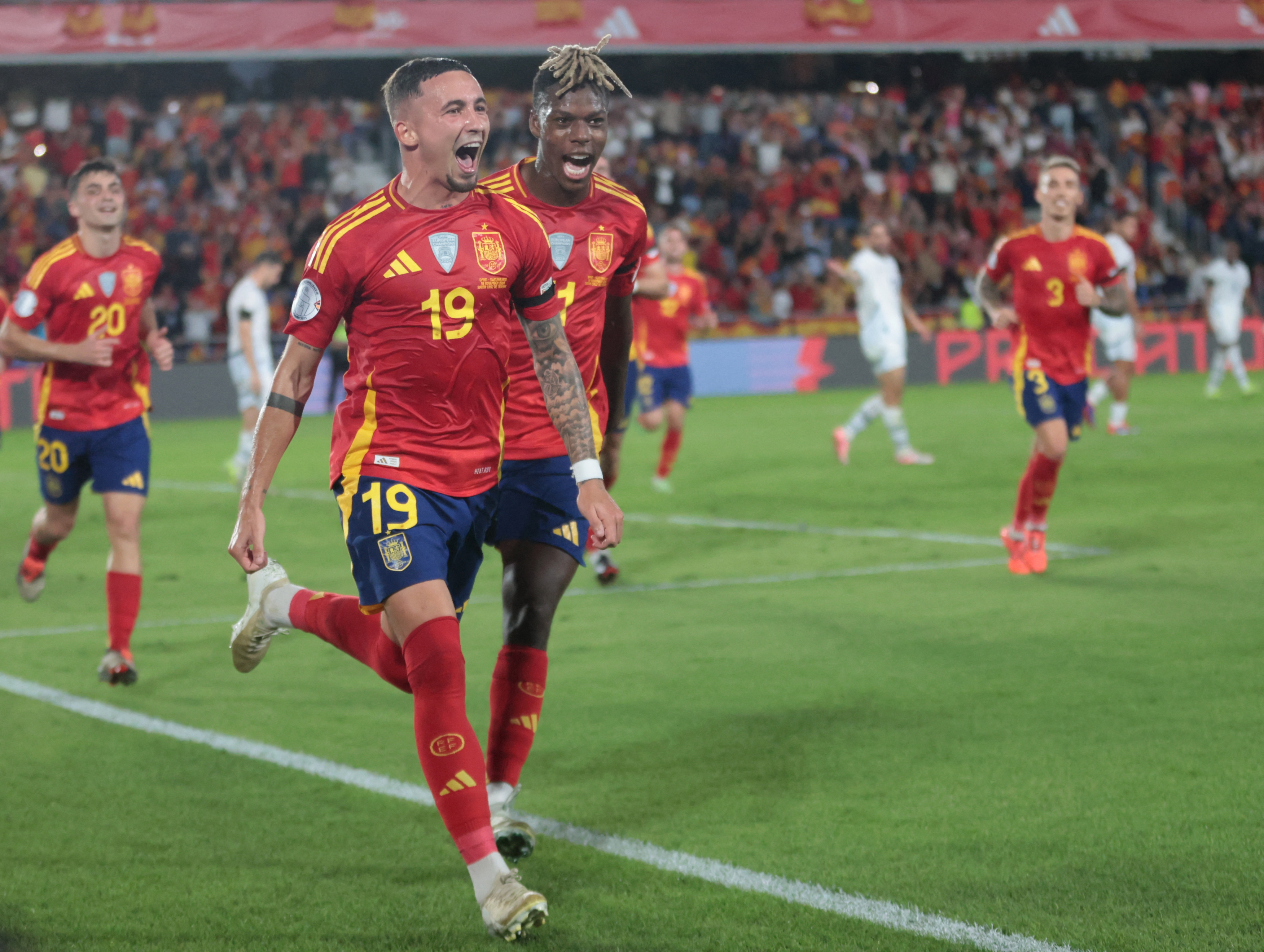 Spain's forward #19 Yeremi Pino celebrates with Spain's midfielder #11 Nico Williams scoring his team's first goal during the UEFA Nations League, League A Group A4, football match between Spain and Switzerland at the Heliodoro Rodriguez Lopez stadium in Tenerife, in Spain's Canary Islands, on November 18 2024. (Photo by DESIREE MARTIN / AFP)