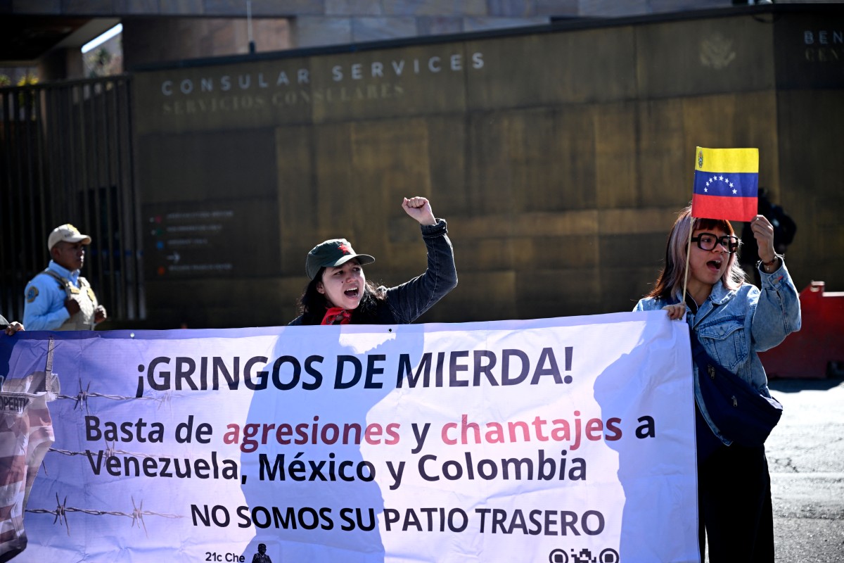EDITORS NOTE: Graphic content / Members of social organizations protest with a sign reading "Shitty gringos. Stop agressions and blackmails to Venezuela, Mexico and Colombia. We are not your backyard," against the US military operation in Venezuela outside the US embassy in Mexico City on January 3, 2026, after US forces captured Venezuelan leader Nicolas Maduro.