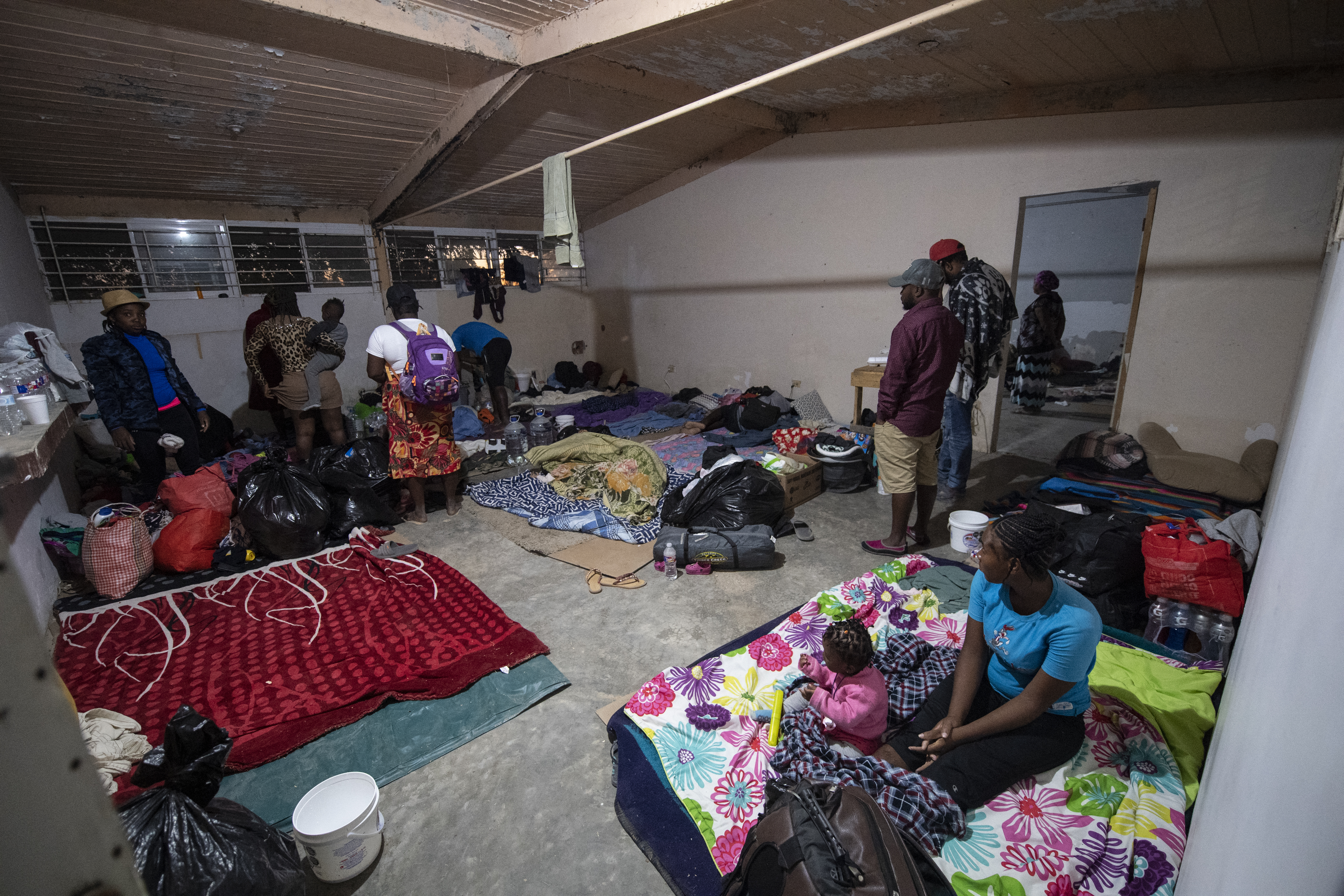 Haitian migrants are seen at a shelter in Ciudad Acuna, Coahuila state, Mexico, on September 23, 2021. - Tens of thousands of migrants, many of them Haitians previously living in South America, have arrived in recent weeks in Mexico hoping to enter the United States. (Photo by PEDRO PARDO / AFP)