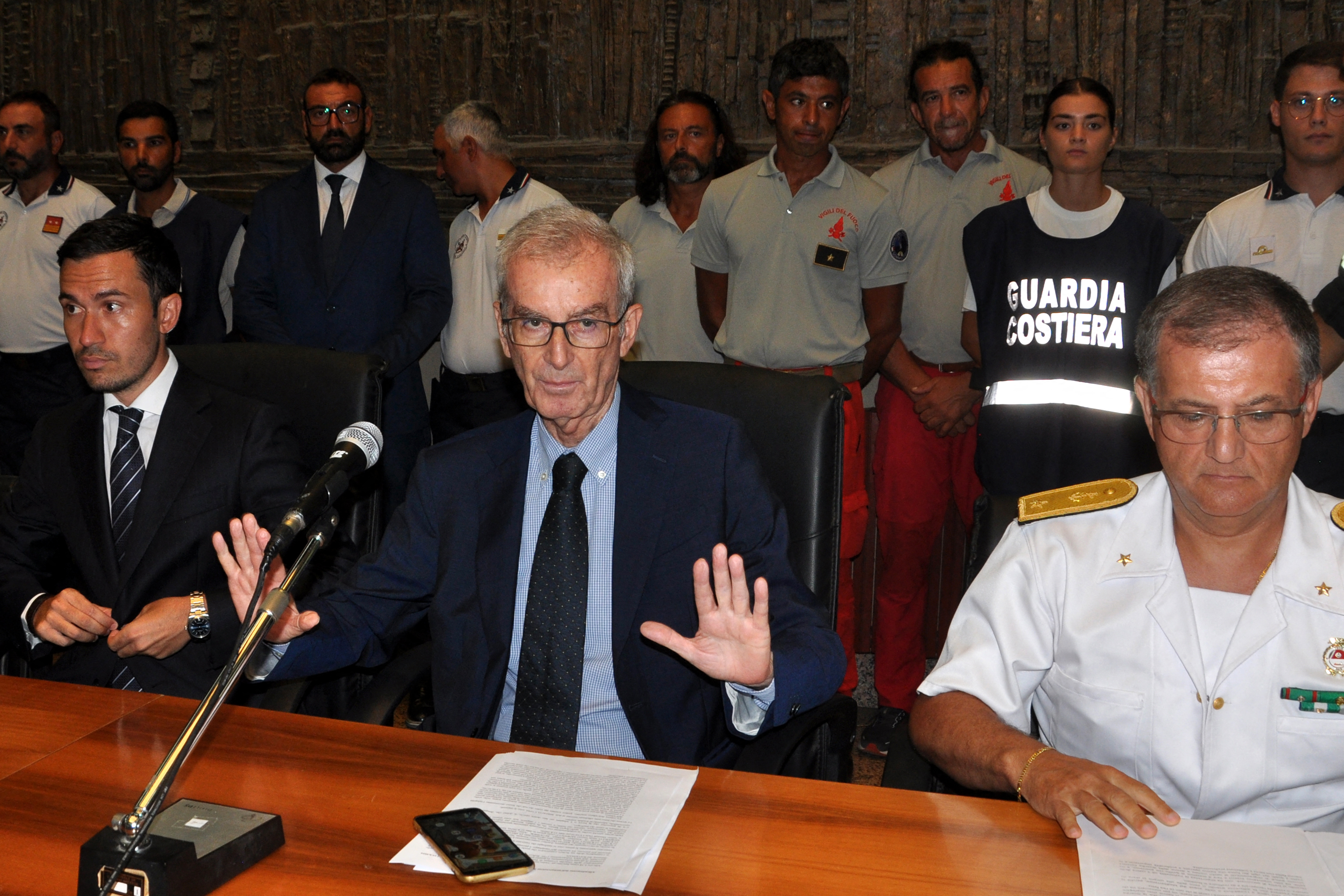 Prosecutor Raffaele Cammarano (L), chief of the public prosecutor's office of Termini Imerese Ambrogio Cartosio (C) and Rear admiral of the Italian Coast Guards Raffaele Macauda (R) give a press conference on August 24, 2024 in Termini Imerese, Sicily. Sicilian prosecutors said they were investigating potential crimes of negligent shipwreck and manslaughter after a superyacht sank killing seven people, including UK tech tycoon Mike Lynch.
