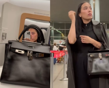 Una atractiva mujer que llevaba un Hermes Birkin handbag camina delante de  una enorme Louis Vuitton (LV) maleta fuera del centro comercial Plaza 66 en  Shanghai, China, 4 Fotografía de stock - Alamy