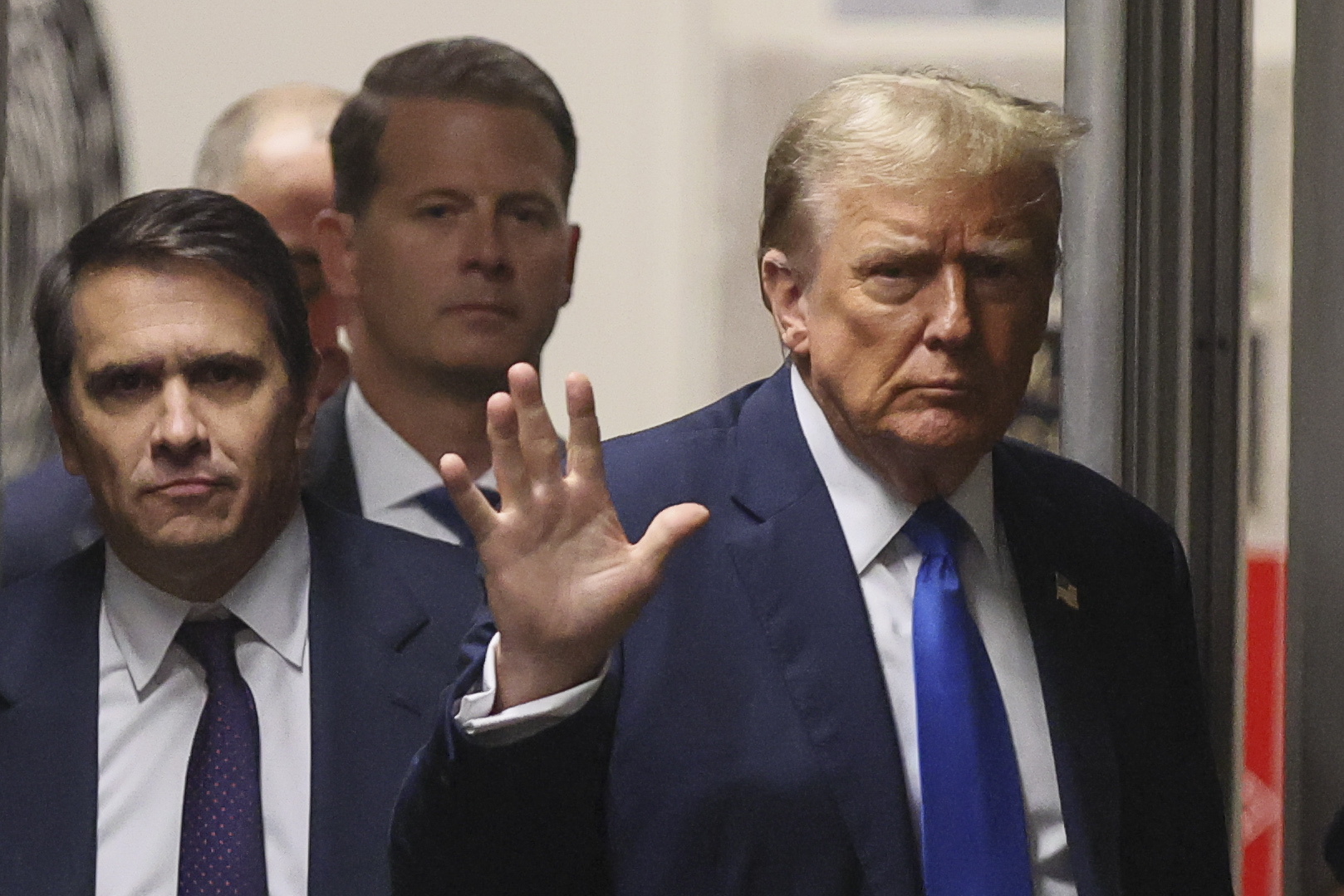 New York (United States), 18/04/2024.- Former US President Donald Trump (R) gestures, while he walks during a recess in his trial for allegedly covering up hush money payments linked to extramarital affairs, at Manhattan Criminal Court in New York City, USA, 18 April 2024. Trump's criminal trial resumes with Judge Juan Merchan seeking to complete jury selection. Trump is facing 34 felony counts of falsifying business records related to payments made to adult film star Stormy Daniels during his 2016 presidential campaign. (tormenta, Nueva York) EFE/EPA/Brendan McDermid / POOL