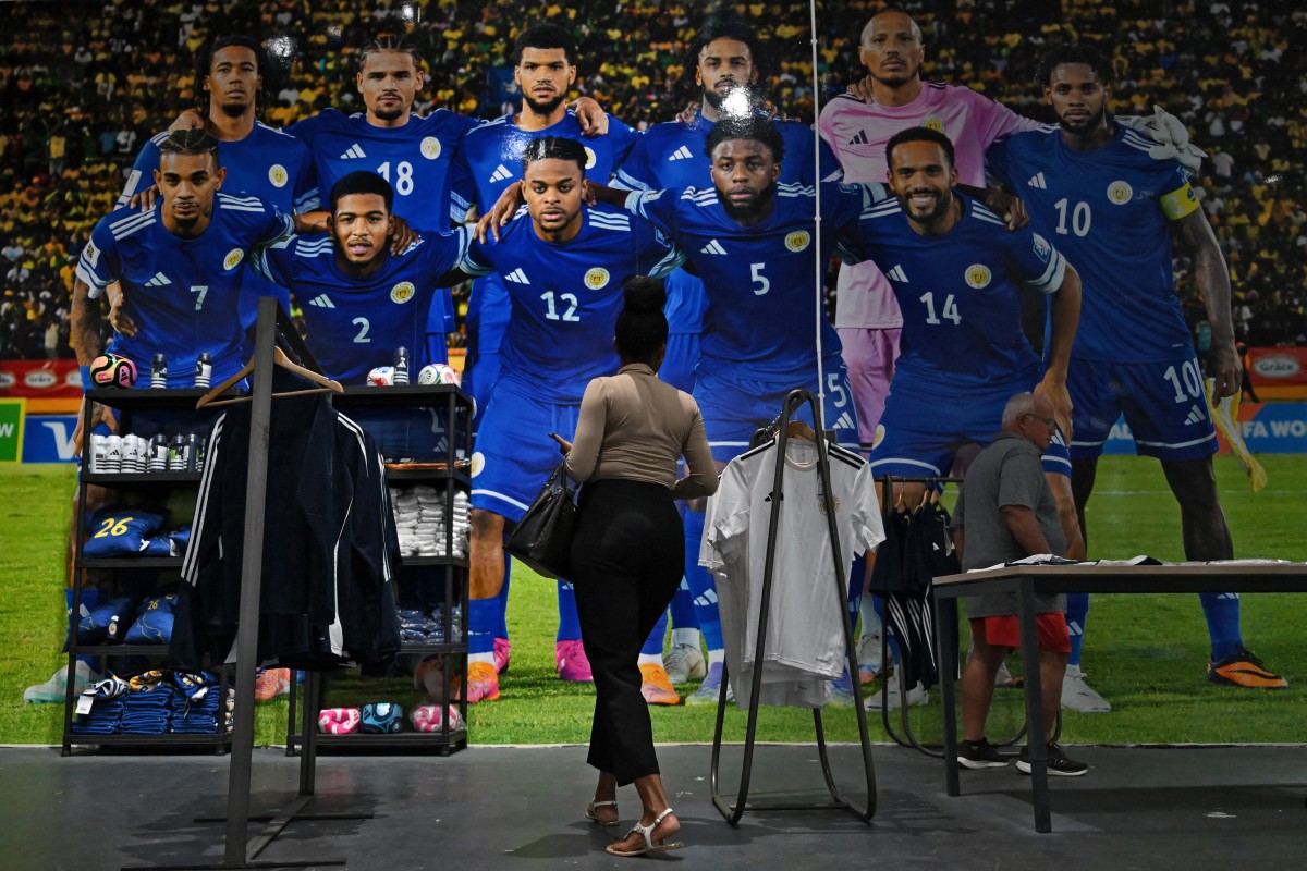 TOPSHOT - A woman shops at the Curacao national football team official fan store in Willemstad, Curacao, in the Dutch Caribbean, on April 8, 2026.