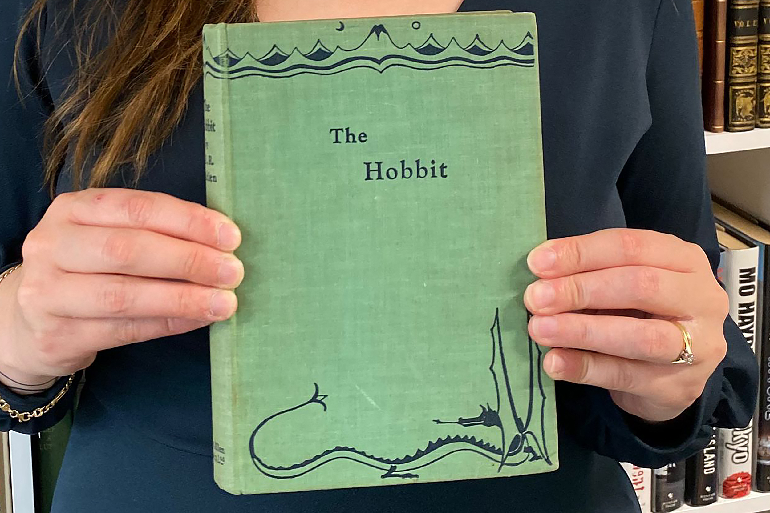 An undated recent handout picture released by Auctioneum auction house shows a rare first edition of J.R.R. Tolkien's 'The Hobbit' at the auction house in Bristol, southewest England ahead of the book's sale. A rare first edition of J.R.R. Tolkien's "The Hobbit" sold for 43,000 pounds ($57,000) at auction on August 7, 2025, after it was found during a house clearance in southwest England. (Photo by AUCTIONEUM / AFP) / RESTRICTED TO EDITORIAL USE - MANDATORY CREDIT "AFP PHOTO /  AUCTIONEUM " - HANDOUT - NO MARKETING NO ADVERTISING CAMPAIGNS - DISTRIBUTED AS A SERVICE TO CLIENTS