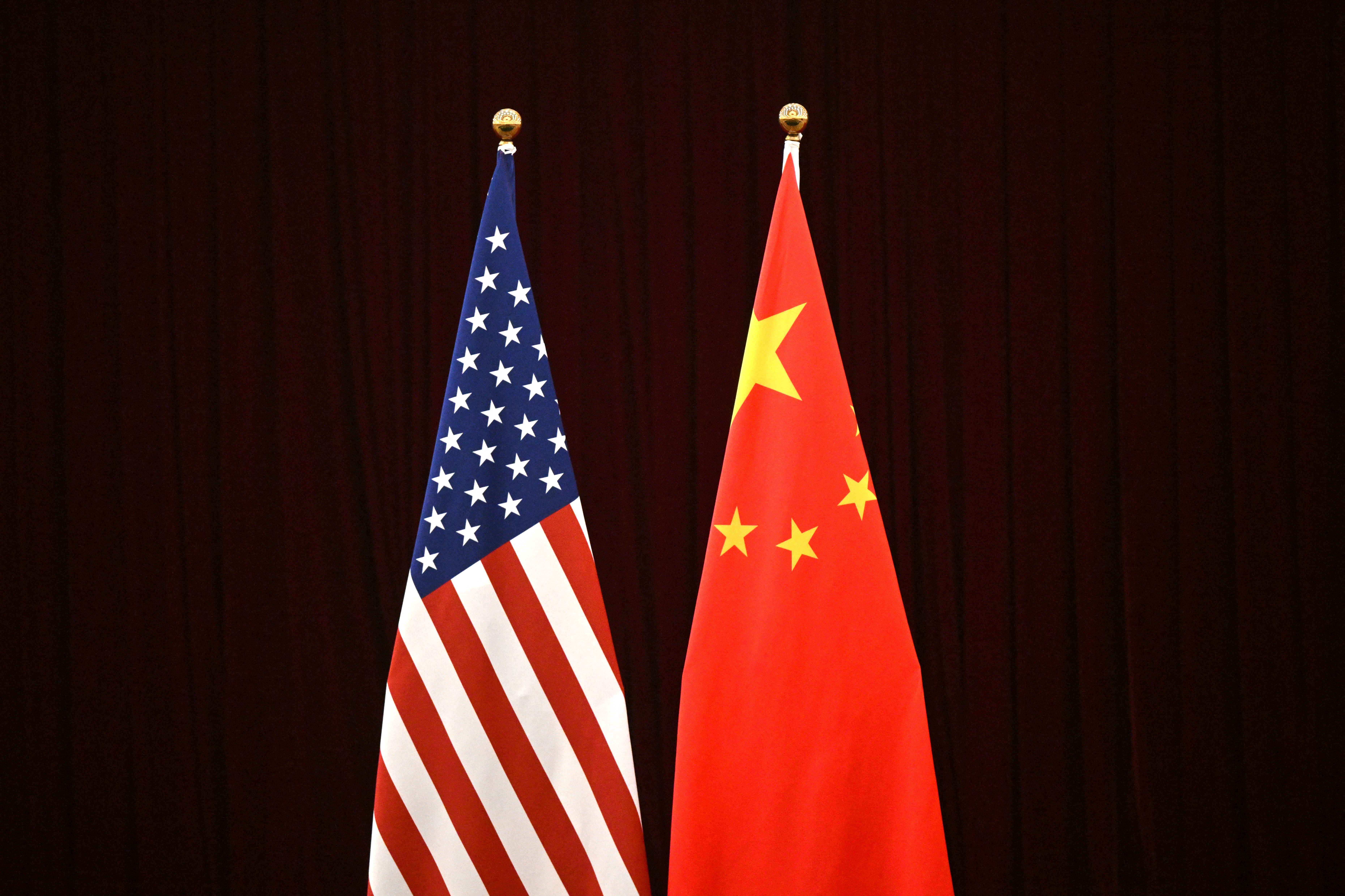 (FILES) This photo shows a gerenal view of China's and USA's flags during a meeting between US Treasury Secretary Janet Yellen and China's Vice Premier He Lifeng at the Guangdong Zhudao Guest House in the southern Chinese city of Guangzhou, on April 5, 2024.