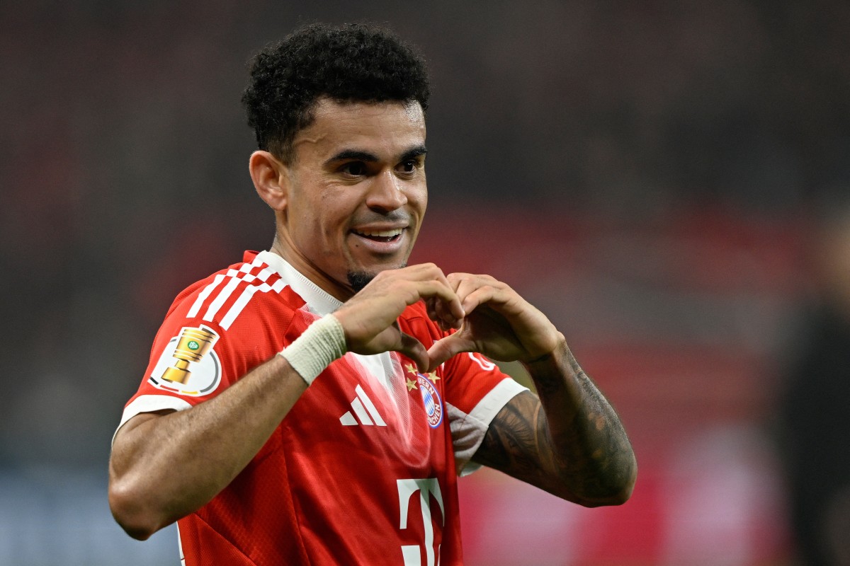 Bayern Munich's Colombian forward #14 Luis Diaz celebrates scoring the 0-2 goal with his teammates during the German Cup (DFB-Pokal) semi-final football match between Bayer 04 Leverkusen and FC Bayern Munich in Leverkusen, western Germany on April 22, 2026.