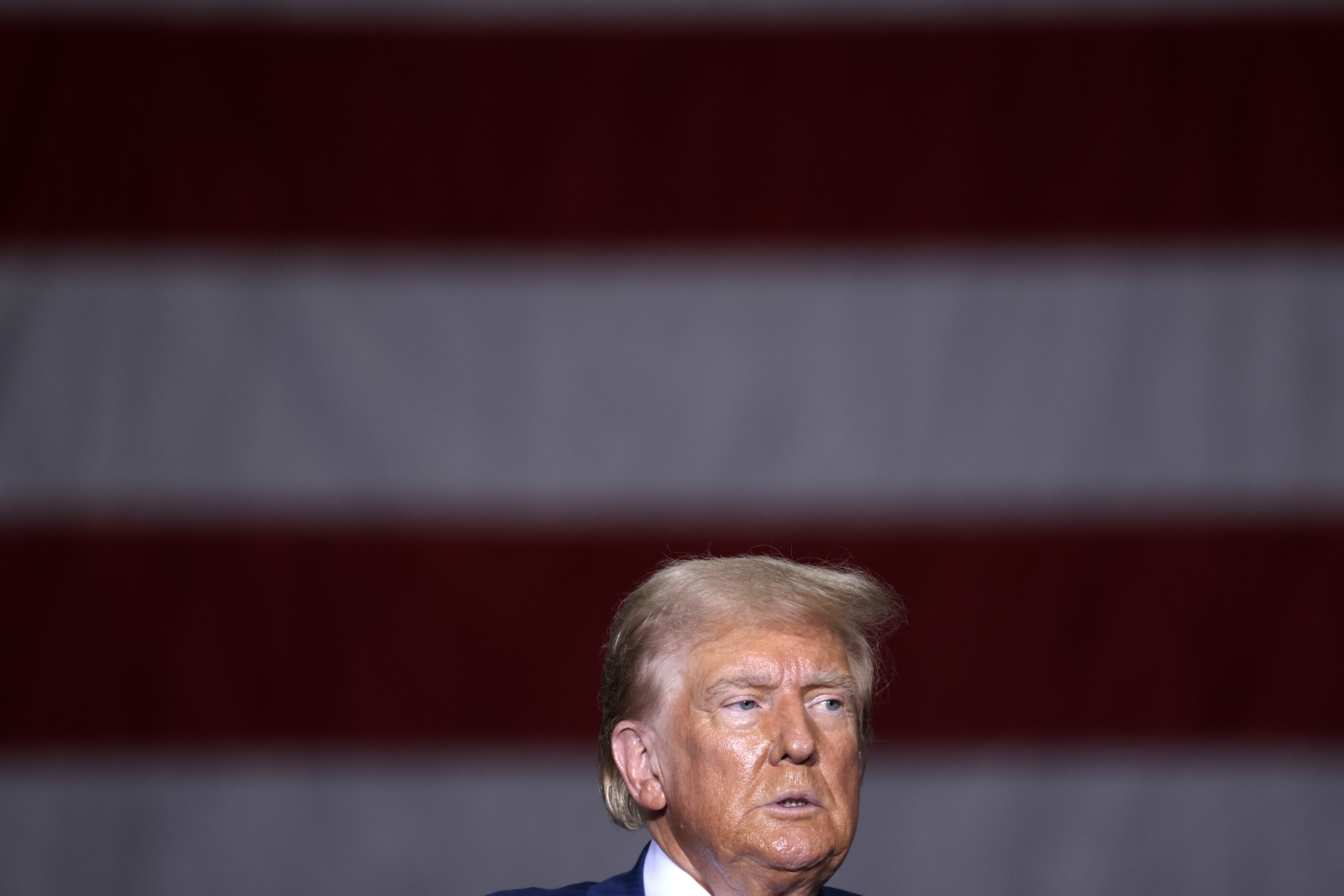 TOPSHOT - Former US President and Republican presidential candidate Donald Trump speaks about the economy during a campaign event in Potterville, Michigan, on August 29, 2024. (Photo by JEFF KOWALSKY / AFP)