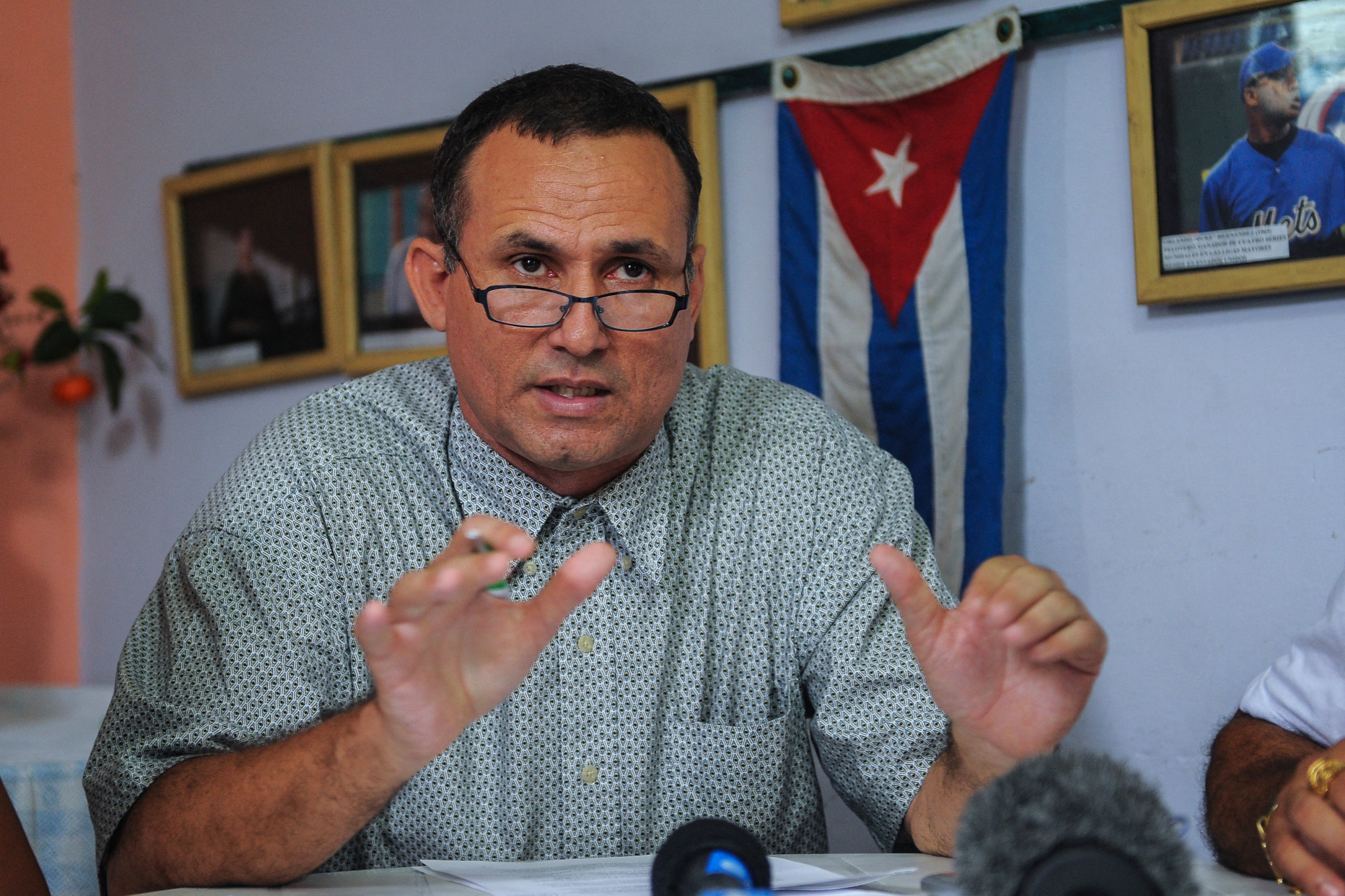 (FILES) Cuban opposition leader Jose Daniel Ferrer speaks during a press conference to present the ¬Towards a national project, the minimum program¬ in Havana on May 12, 2016.