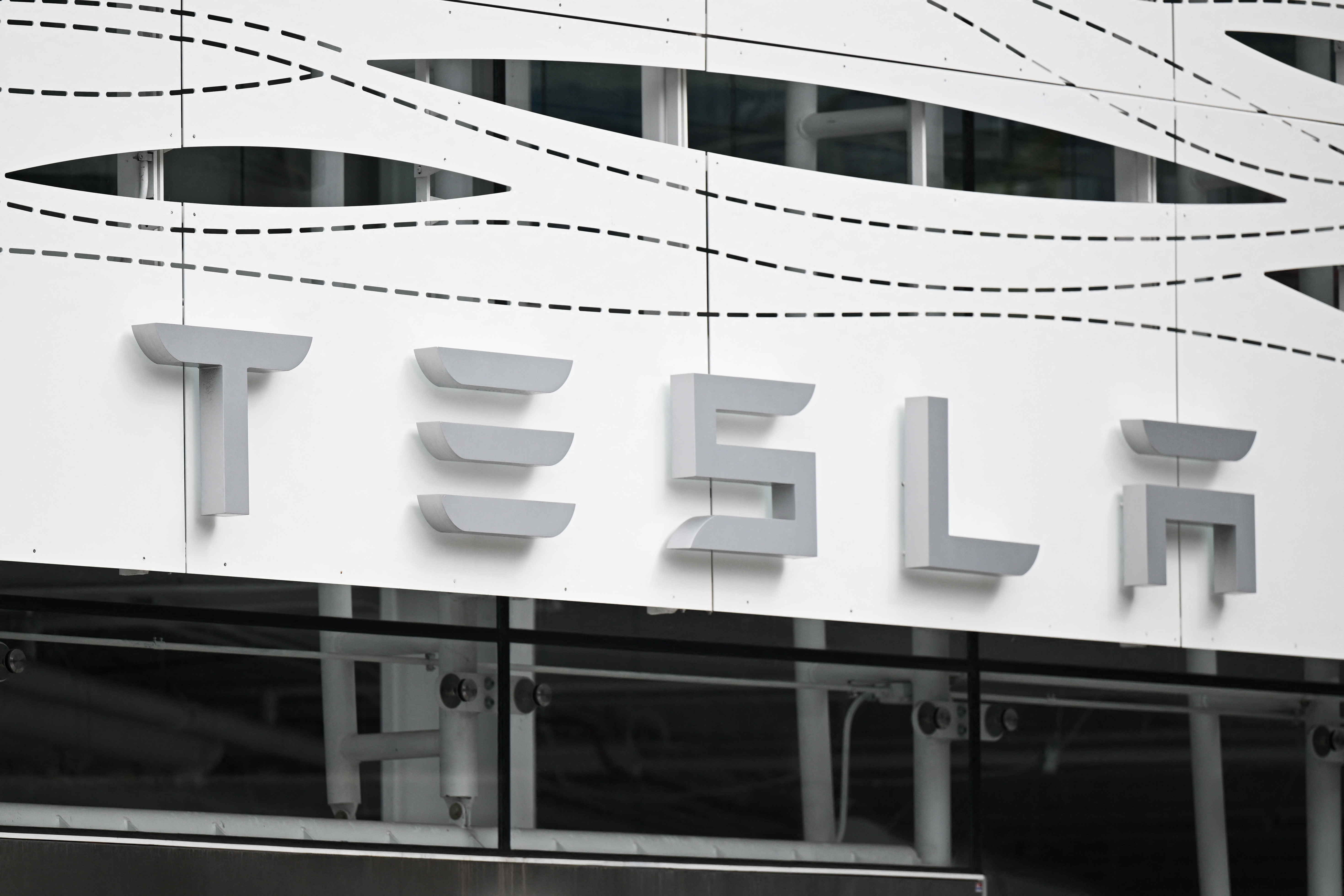 (FILES) The Tesla logo is seen at the Santa Monica Place store in Santa Monica, California, on March 20, 2023.