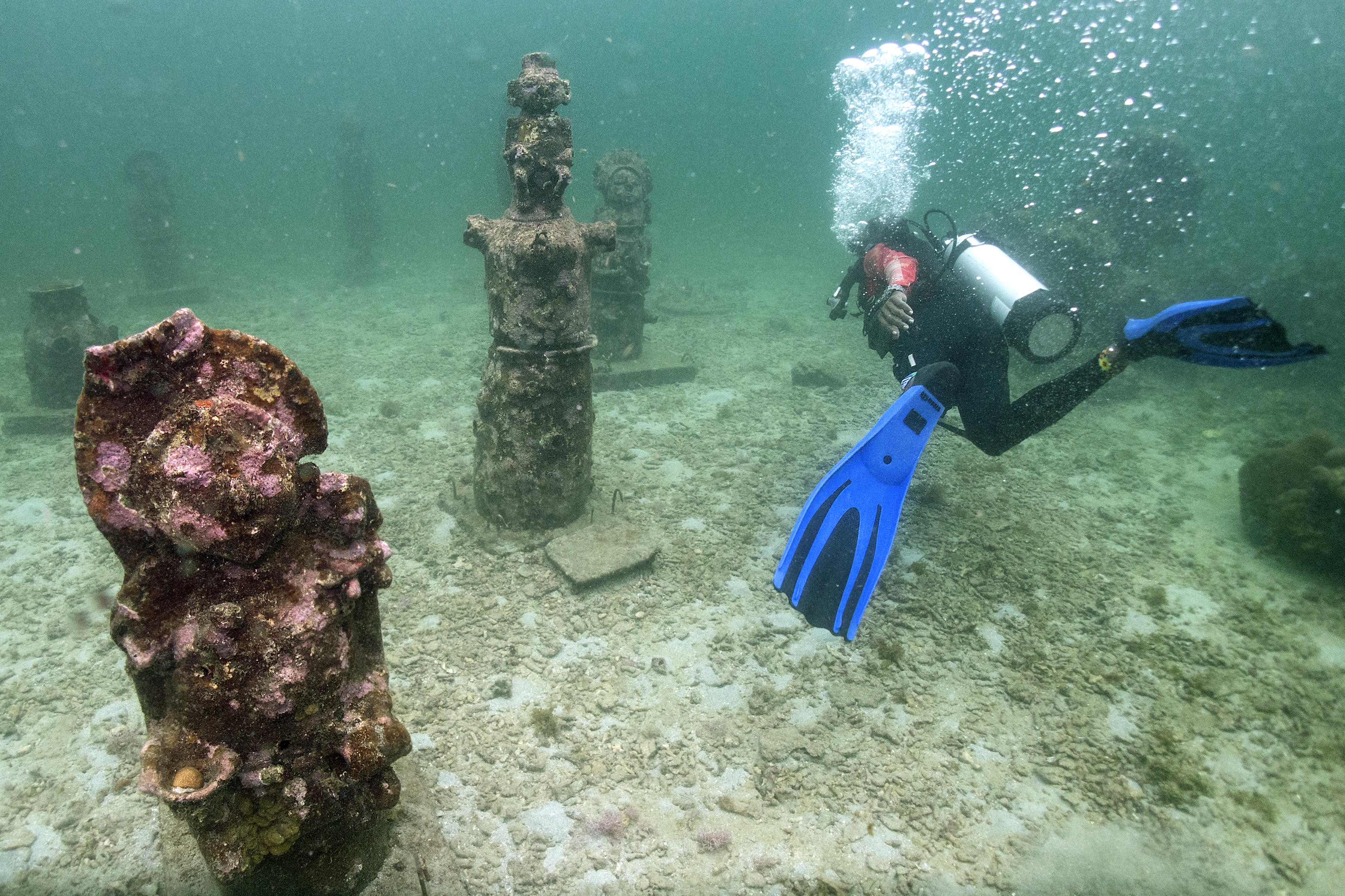 TOPSHOT - Guide Orlis Navas dives in the MUSZIF underwater museum in Isla Fuerte, Bolivar department, Colombia, on May 22, 2024.