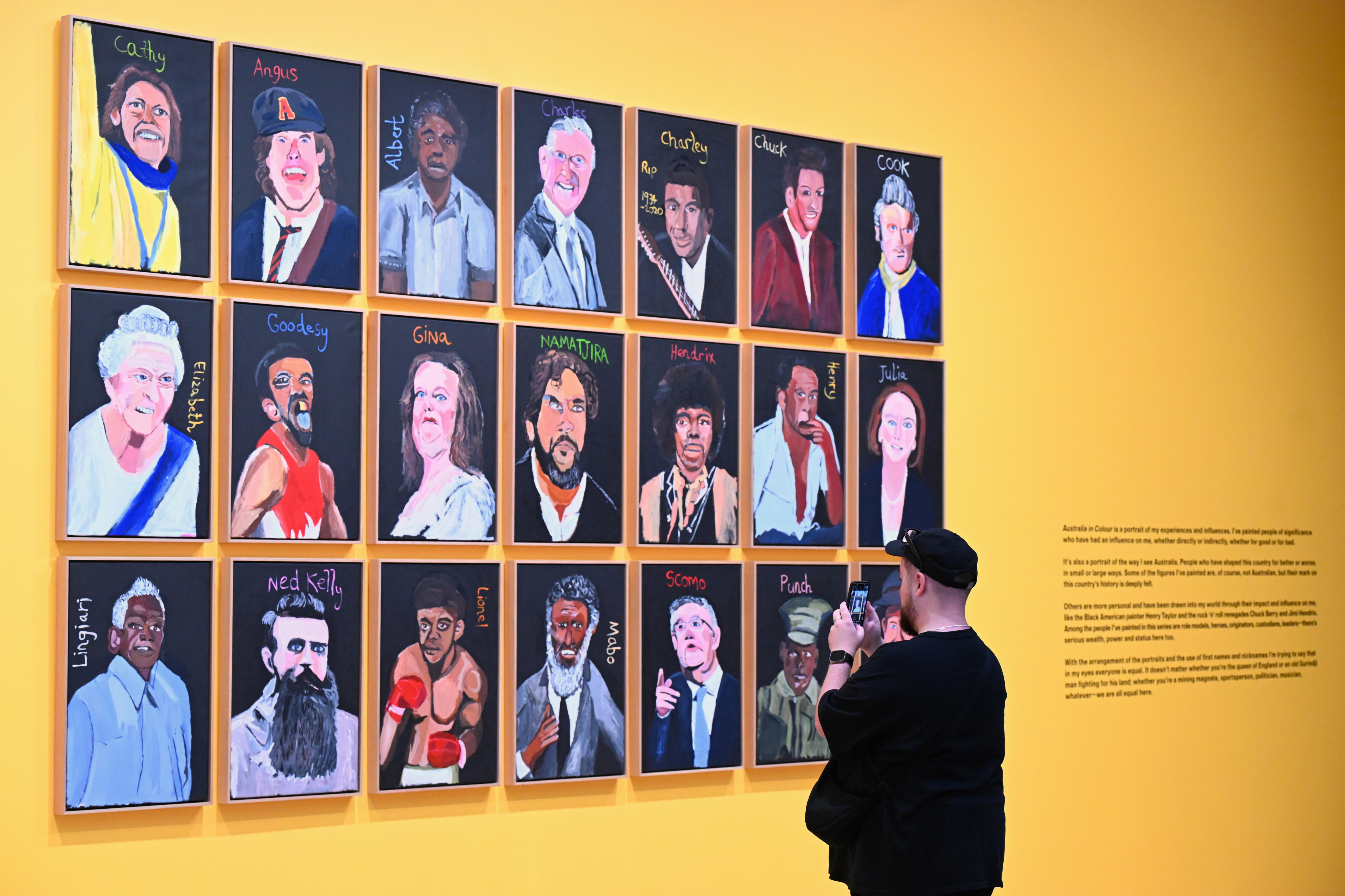 Canberra (Australia), 17/05/2024.- A visitor takes a picture of a portrait of Australian billionaire Gina Rinehart, which forms part of an artwork+titled+ëAustralia in Colour, 2021í by artist Vincent Namatjira at the National Gallery of Australia, in Canberra, Australia, 17 May 2024. EFE/EPA/LUKAS COCH AUSTRALIA AND NEW ZEALAND OUT