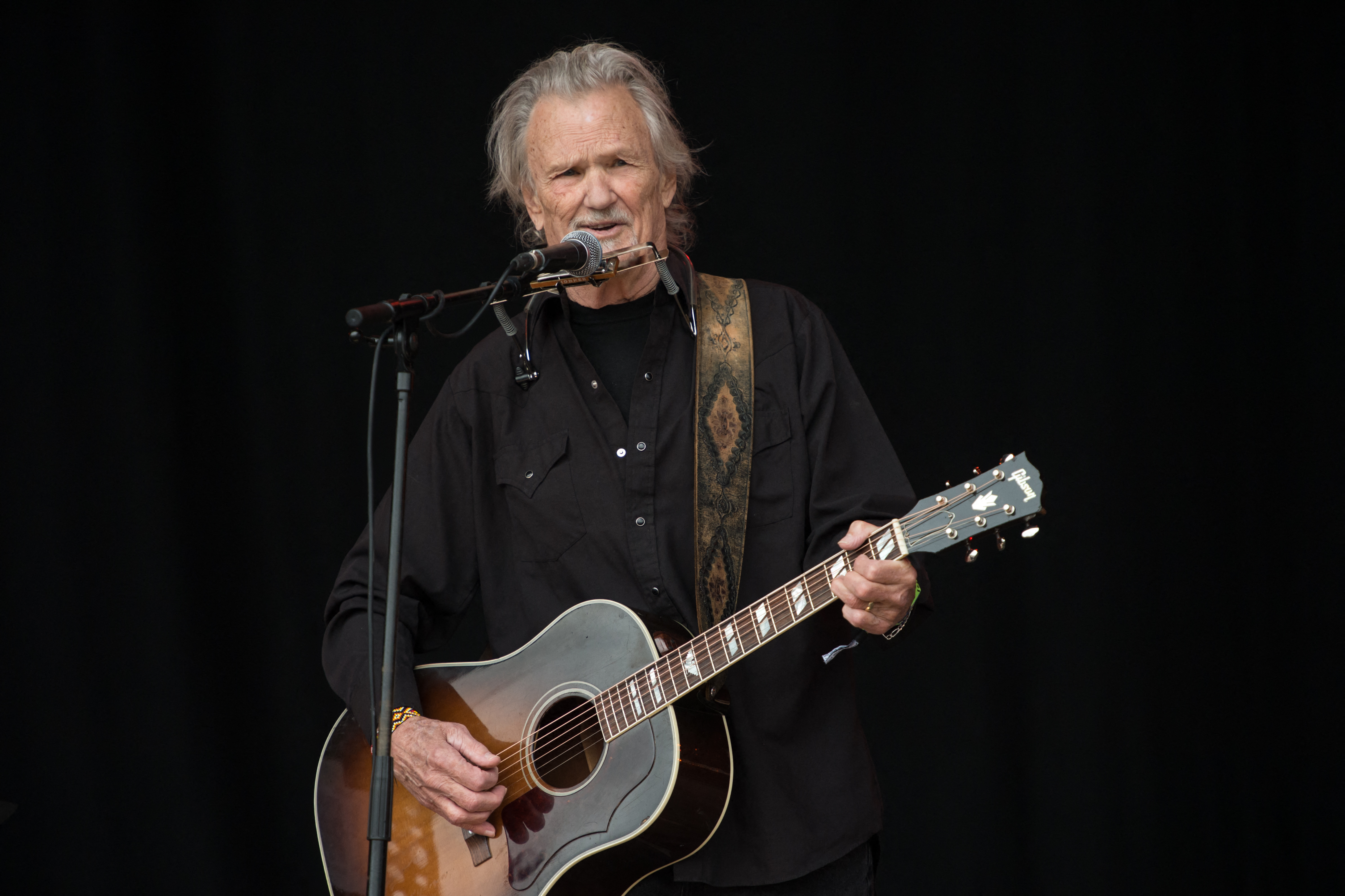 (FILES) Kris Kristofferson performs on the Pyramid Stage at the Glastonbury Festival of Music and Performing Arts on Worthy Farm near the village of Pilton in Somerset, south-west England on June 23, 2017.