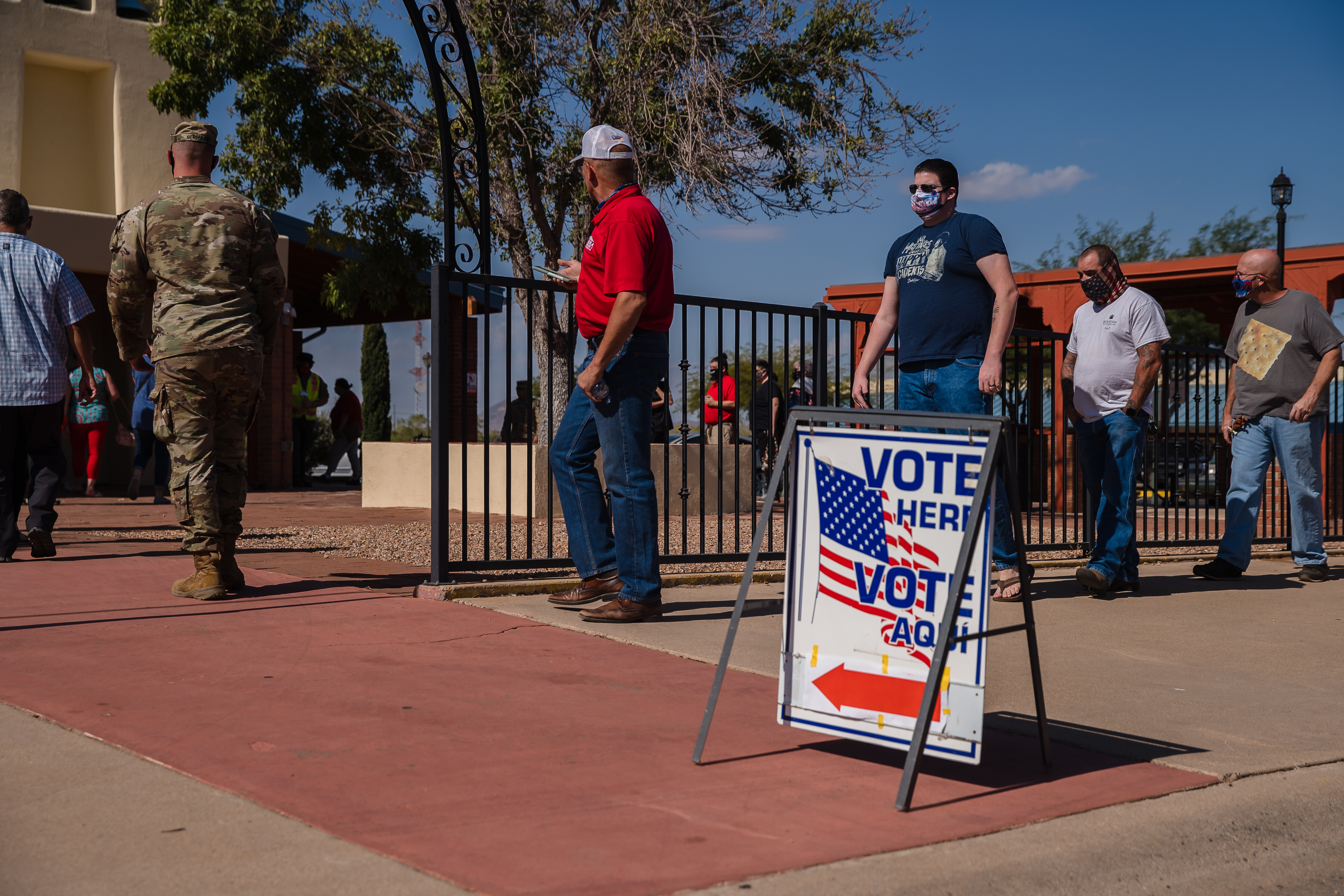 People wait in line to vote in front of a polling station at St. Andrew the Apostle Parish in Sierra Vista, Arizona on November 3, 2020. - The United States started voting Tuesday in an election amounting to a referendum on Donald Trump's uniquely brash and bruising presidency, which Democratic opponent and frontrunner Joe Biden urged Americans to end to restore "our democracy." (Photo by ARIANA DREHSLER / AFP)