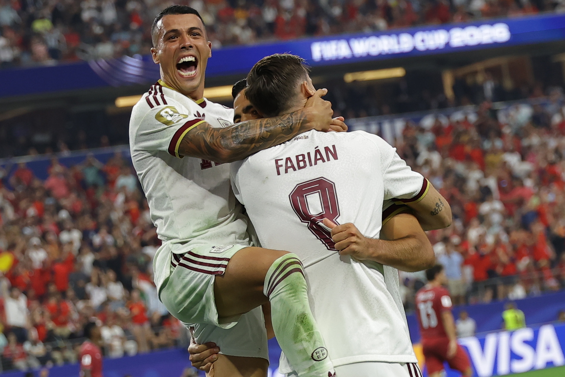 DALLAS (United States), 06/07/2026.- Mikel Merino (R) of Spain celebrates with Fabian Ruiz (C) and Pedro Porro (up) after scoring the 1-0 lead during the FIFA World Cup 2026 Round of 16 match Portugal against Spain, in Dallas, USA, 06 July 2026. (España) EFE/EPA/CHRISTOPHER NEUNDORF