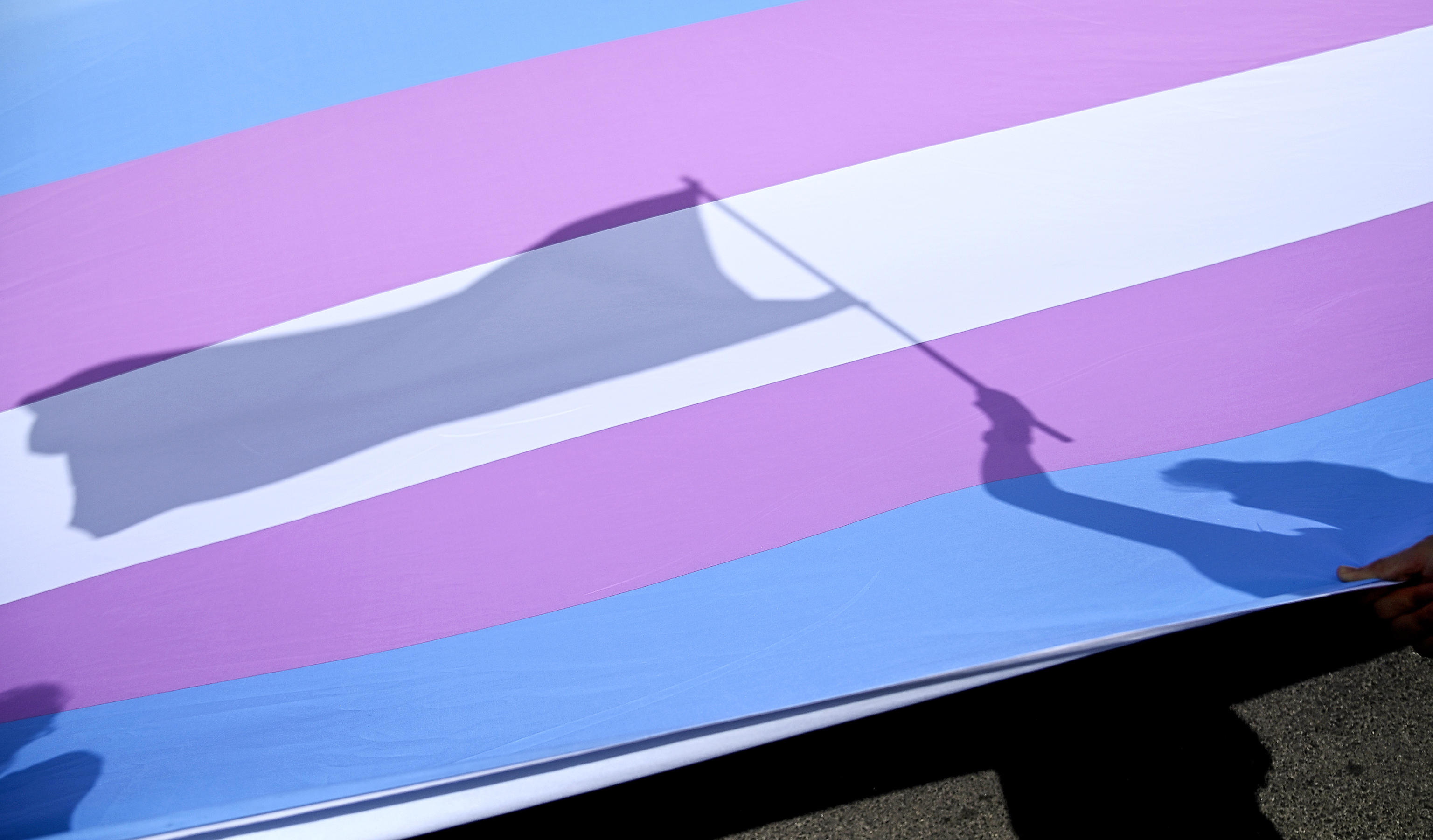 Rome (Italy), 18/05/2024.- A giant LBGTQ+ pride flag is carried along the rally during a demonstration for the self-determination of trans, non-binary and intersex people, against institutional violence, in Rome, Italy, 18 May 2024. (Protestas, Italia, Roma) EFE/EPA/RICCARDO ANTIMIANI