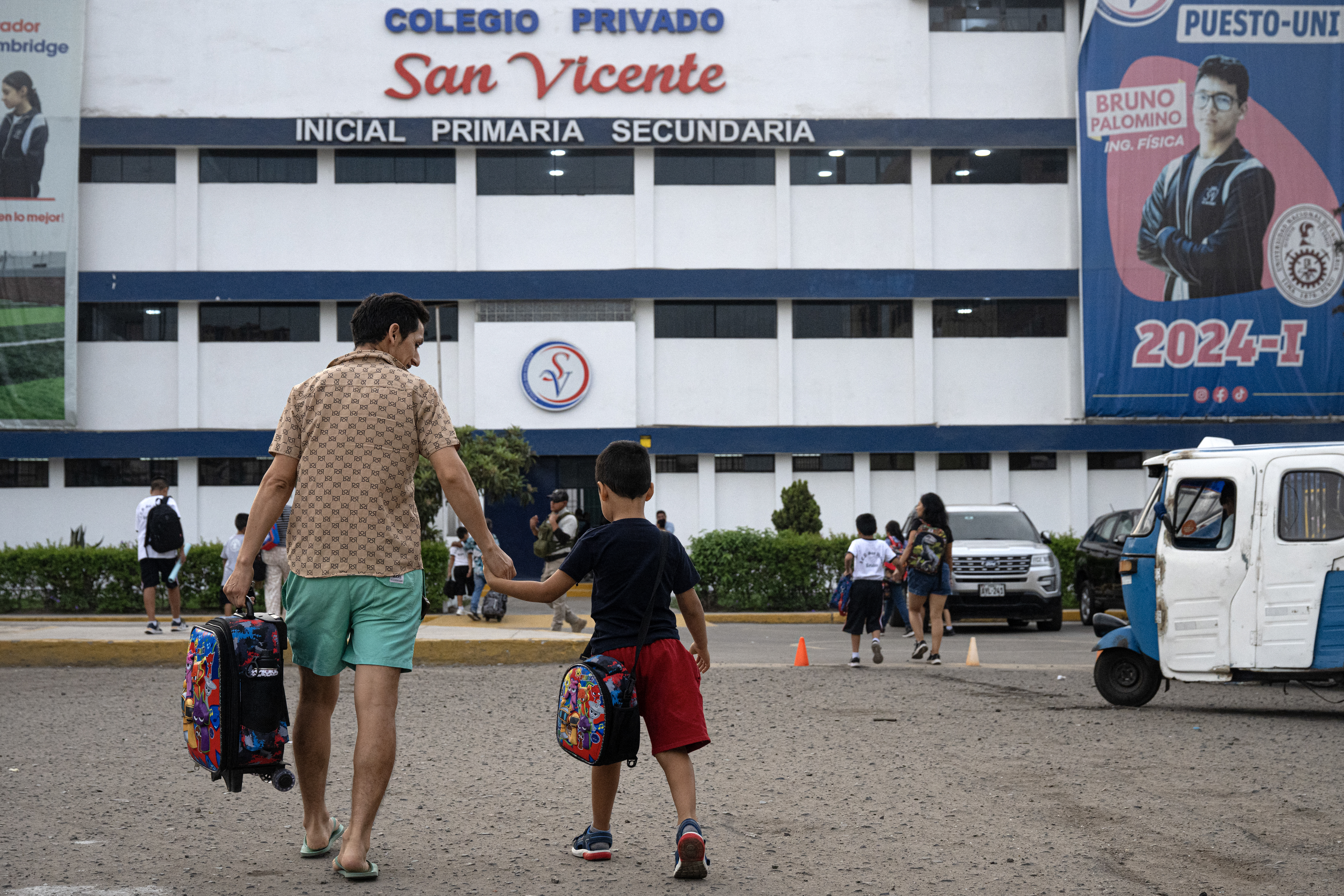 Parents drop off their children at the private San Vicente School, that was victim of extortion, in Lima on April 2, 2025.