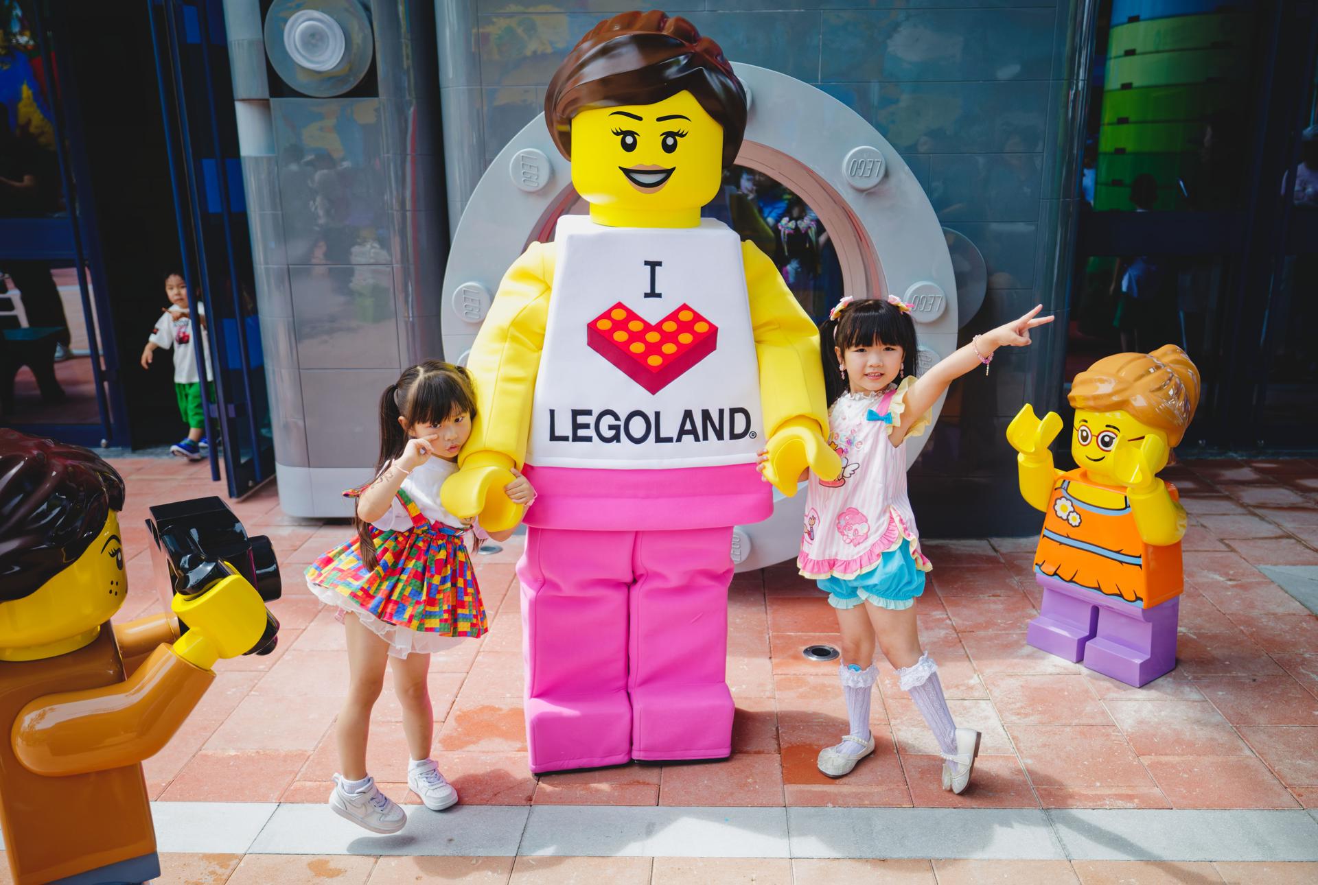 Shanghai (China), 20/06/2025.- Children pose with a mascot during the press day in the new Legoland in Shanghai, China, 20 June 2025. The Legoland Shanghai Resort will open on 05 July 2025. As the world's largest Legoland, it will include eight themed lands, over 75 interactive attractions, and a 250-room Lego-themed hotel. EFE/EPA/ALEX PLAVEVSKI