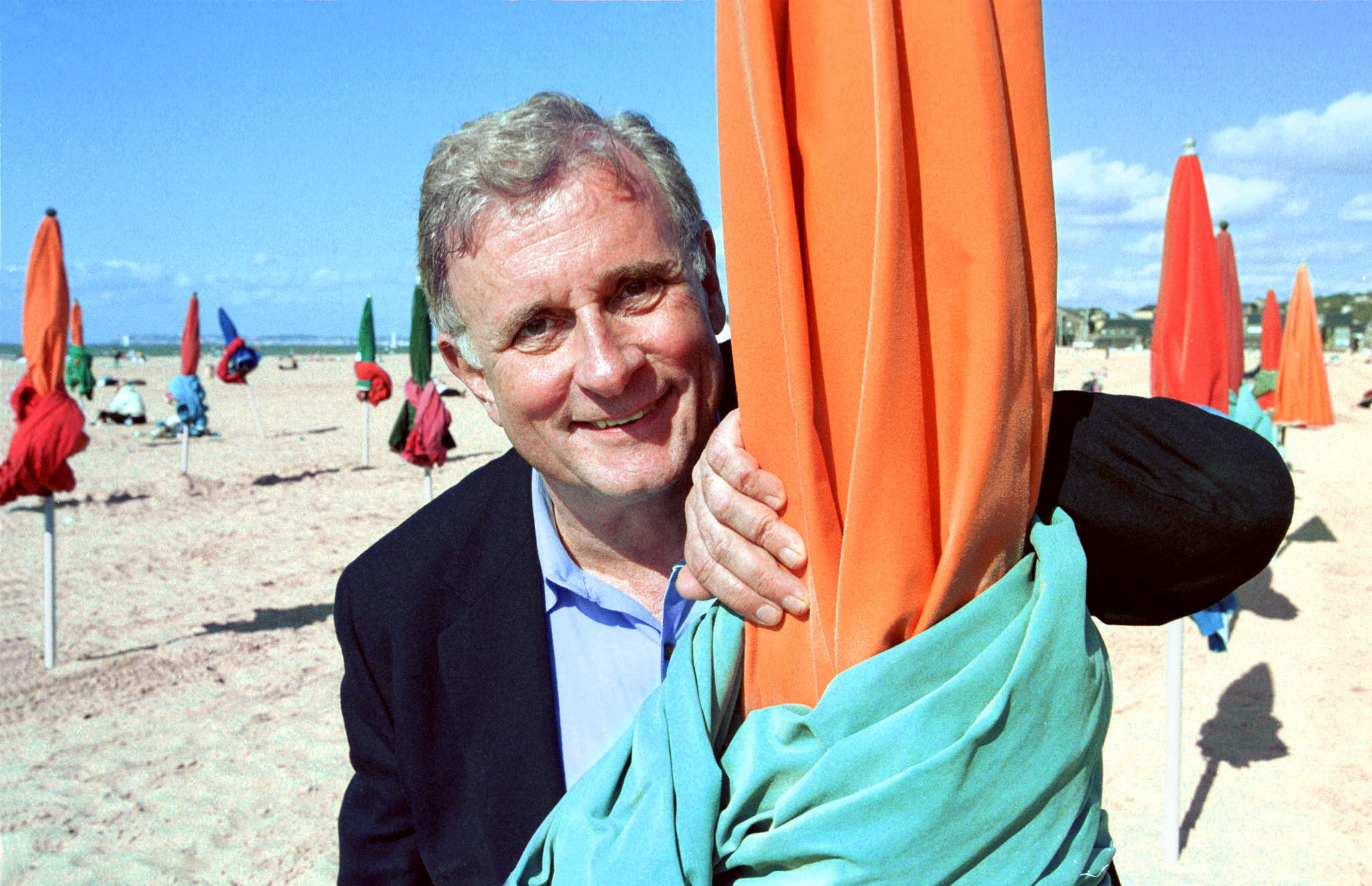 (FILES) US writer Edmund White poses for a photo on September 3, 2000, in Deauville, France, where he received the 2000 Michel d'Ornano Award, a literature award, during the 26th edition of the Deauville American Film Festival.
