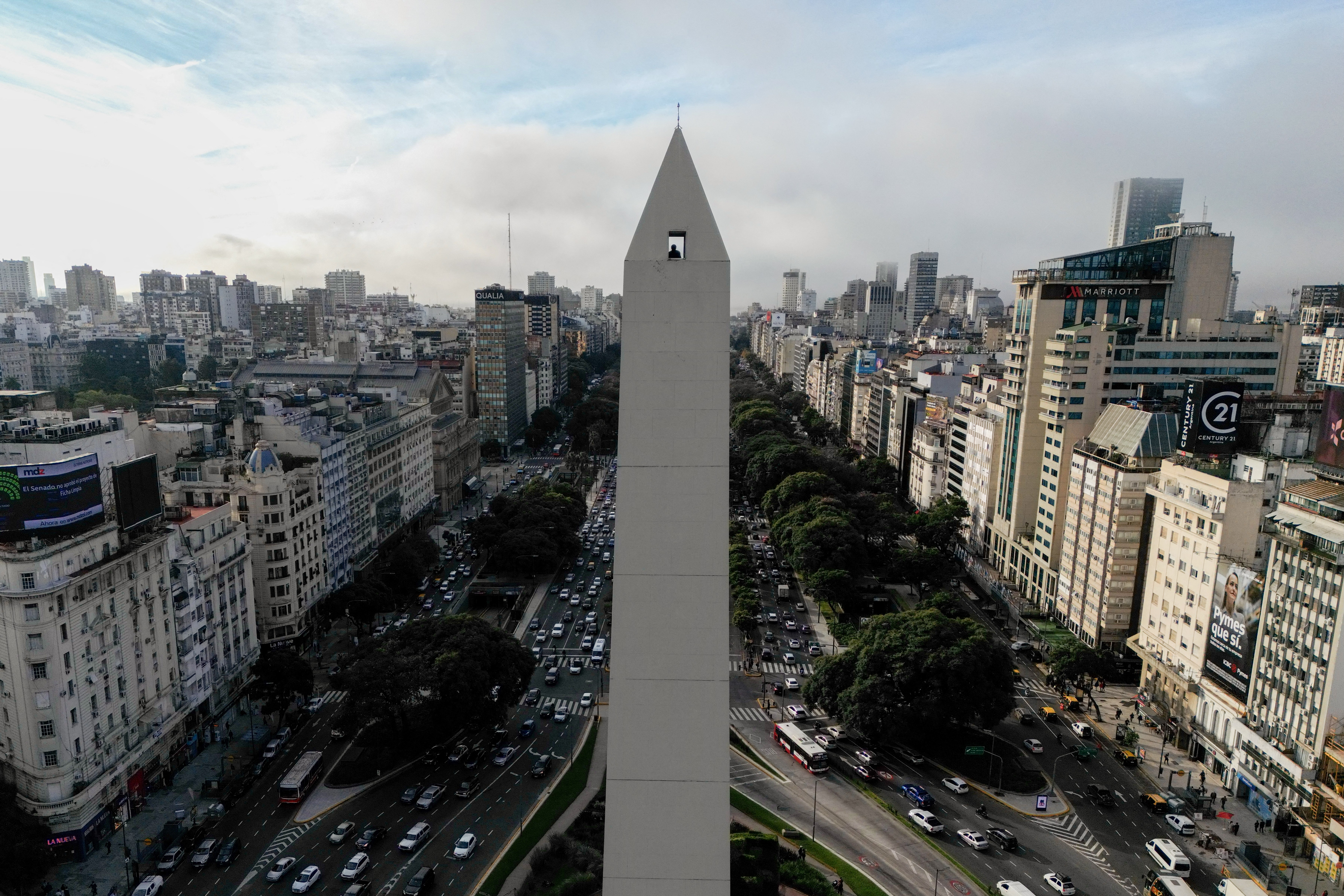 TOPSHOT - Aerial view showing a man looking down from the Obelisk observation deck in Buenos Aires on May 8, 2025.