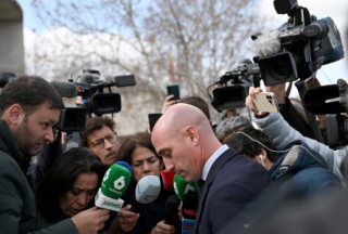 Former president of the Spanish football federation Luis Rubiales, accused of sex assault and coercion over forcible kiss, is surrounded by media as he leaves after taking the stand during his trial at the court of San Fernando de Henares, east of Madrid, on February 11, 2025.