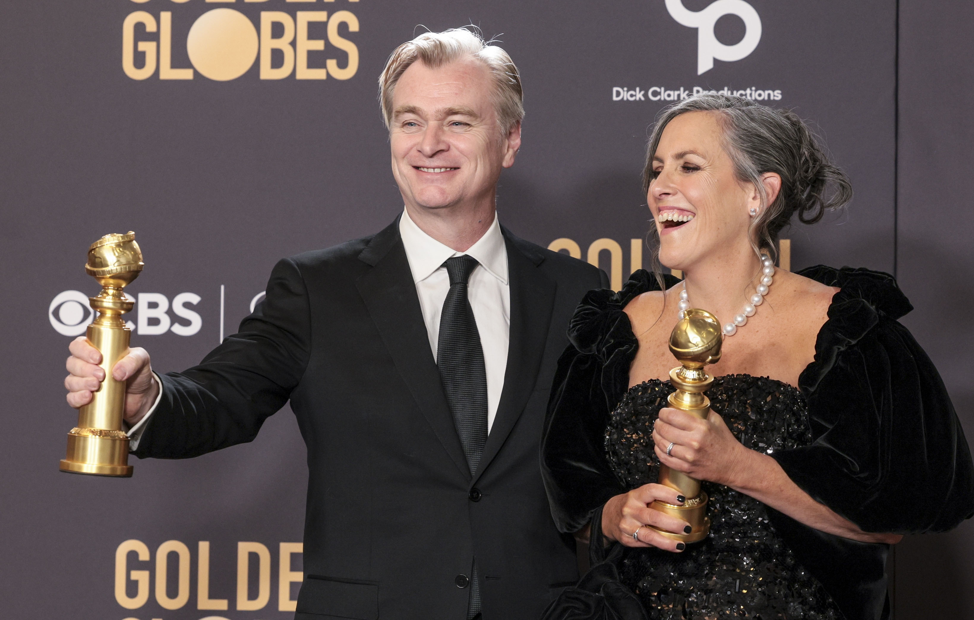 Beverly Hills (United States), 08/01/2024.- British director Christopher Nolan (L) and British film producer Emma Thomas (R) hold their Golden Globe awards for Best Director - Motion Picture and Best Motion Picture - Drama for 'Oppenheimer' in the press room during the 81st annual Golden Globe Awards ceremony at the Beverly Hilton Hotel in Beverly Hills, California, USA, 07 January 2024. Artists in various film and television categories are awarded Golden Globes by the Hollywood Foreign Press Association. EFE/EPA/ALLISON DINNER