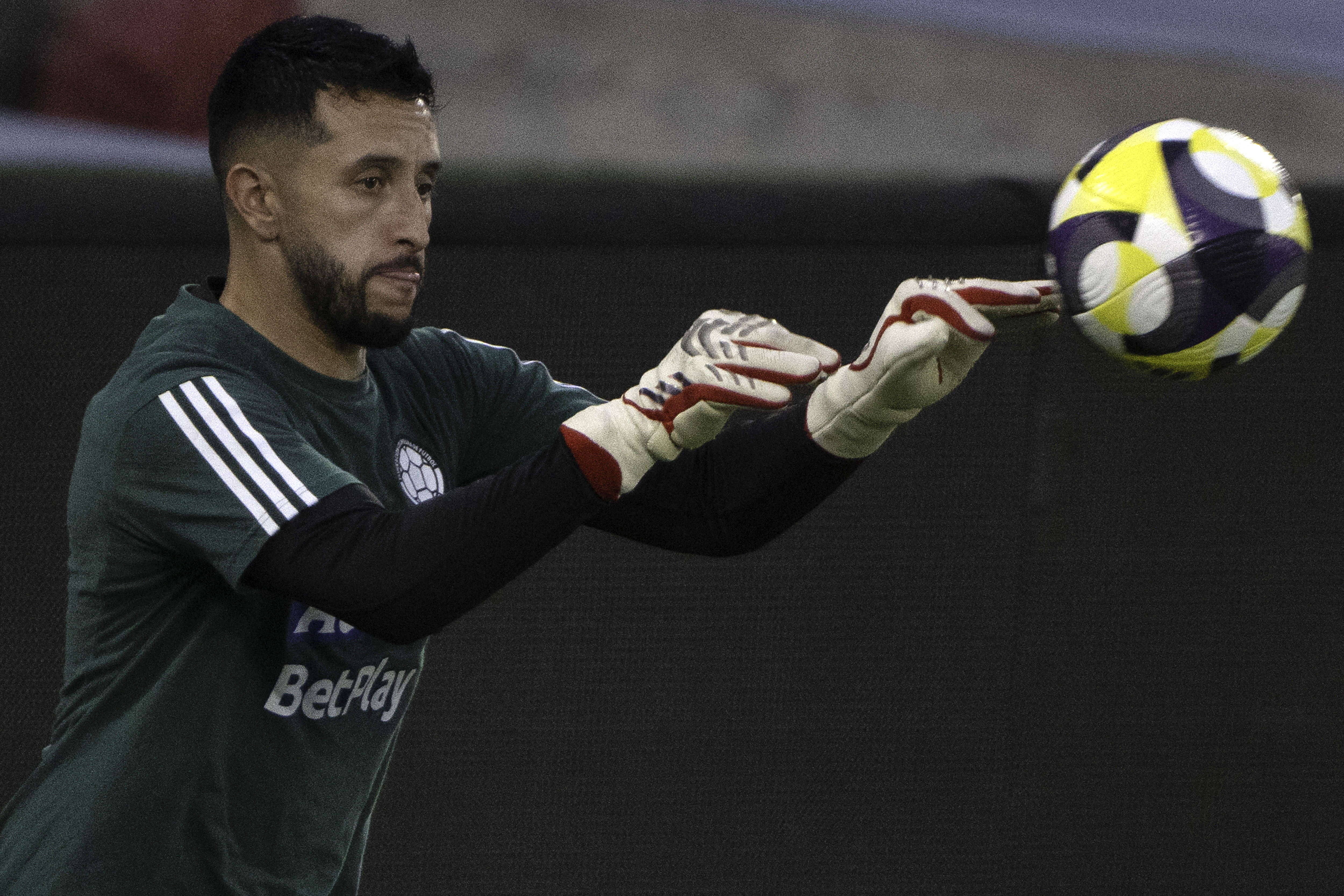 Colombia's goalkeeper Camilo Vargas controls the ball during a training session at the Metropolitano Stadium in Barranquilla, Colombia on March 24, 2025.