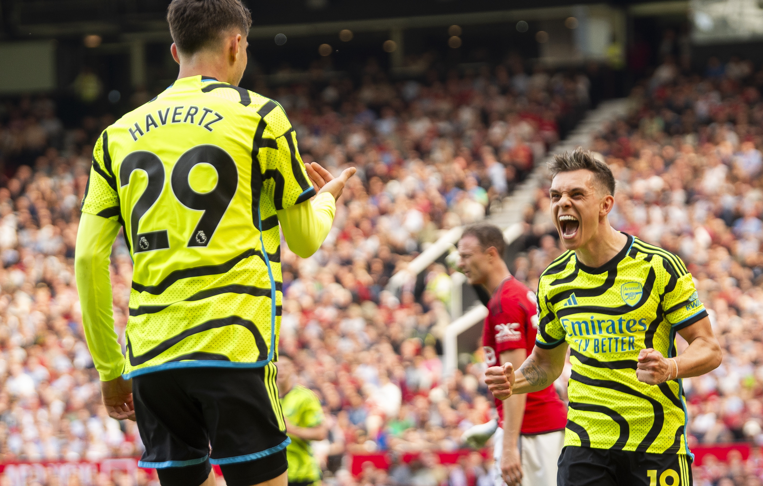 Manchester (United Kingdom), 12/05/2024.- Leandro Trossard of Arsenal celebrates scoring the 0-1 goal with his teammtae Kai Havertz (L) who assisted the goal during the English Premier League soccer match between Manchester United and Arsenal in Manchester, Britain, 12 May 2024. (Reino Unido) EFE/EPA/PETER POWELL EDITORIAL USE ONLY. No use with unauthorized audio, video, data, fixture lists, club/league logos, 'live' services or NFTs. Online in-match use limited to 120 images, no video emulation. No use in betting, games or single club/league/player publications.
