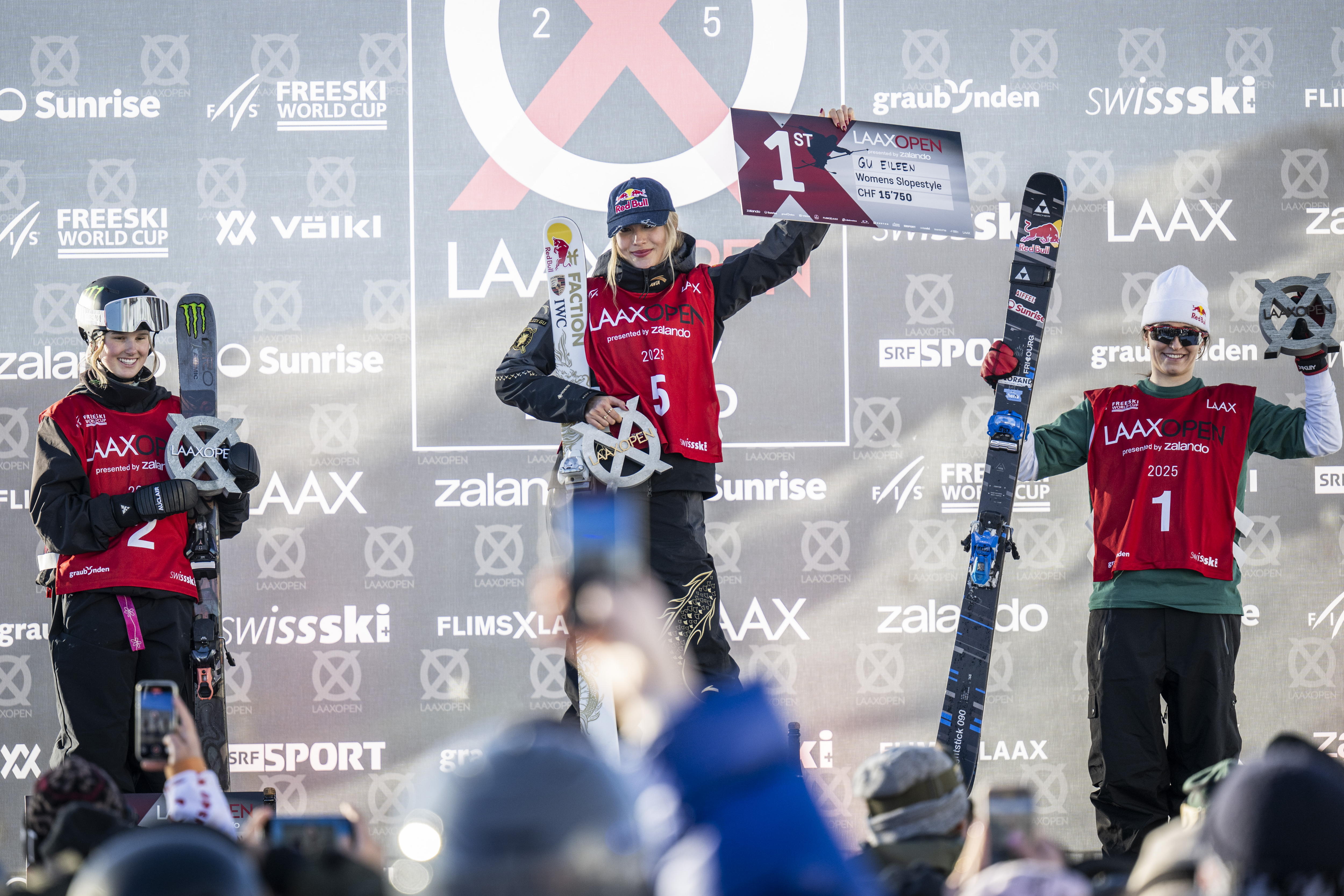 Laax (Switzerland Schweiz Suisse), 17/01/2025.- The women's podium with (L-R) second placed Megan Oldham of Canada, winner Ailing Eileen Gu of China and third placed Mathilde Gremaud of Switzerland celebrating after the final run of the Freeski Slopestyle World Cup at the Laax Open in Laax, Switzerland, 17 January 2025. (Suiza) EFE/EPA/GIAN EHRENZELLER