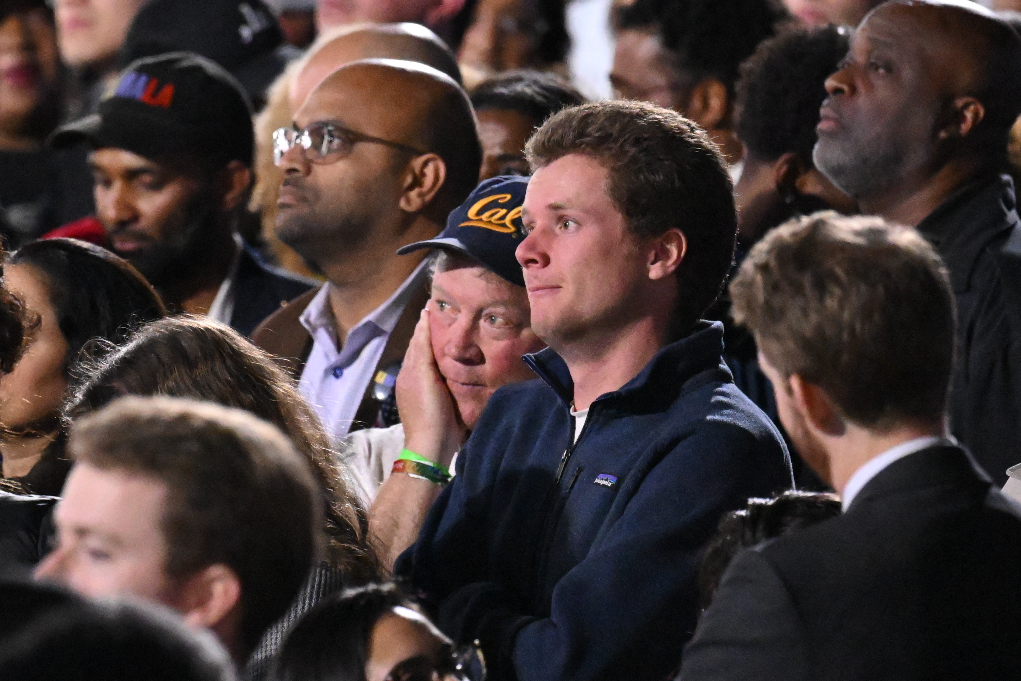 Supporters of US Vice President and Democratic presidential candidate Kamala Harris react as they watch results come in on a screen during an election night event at Howard University in Washington, DC, on November 5, 2024. (Photo by Mandel NGAN / AFP)