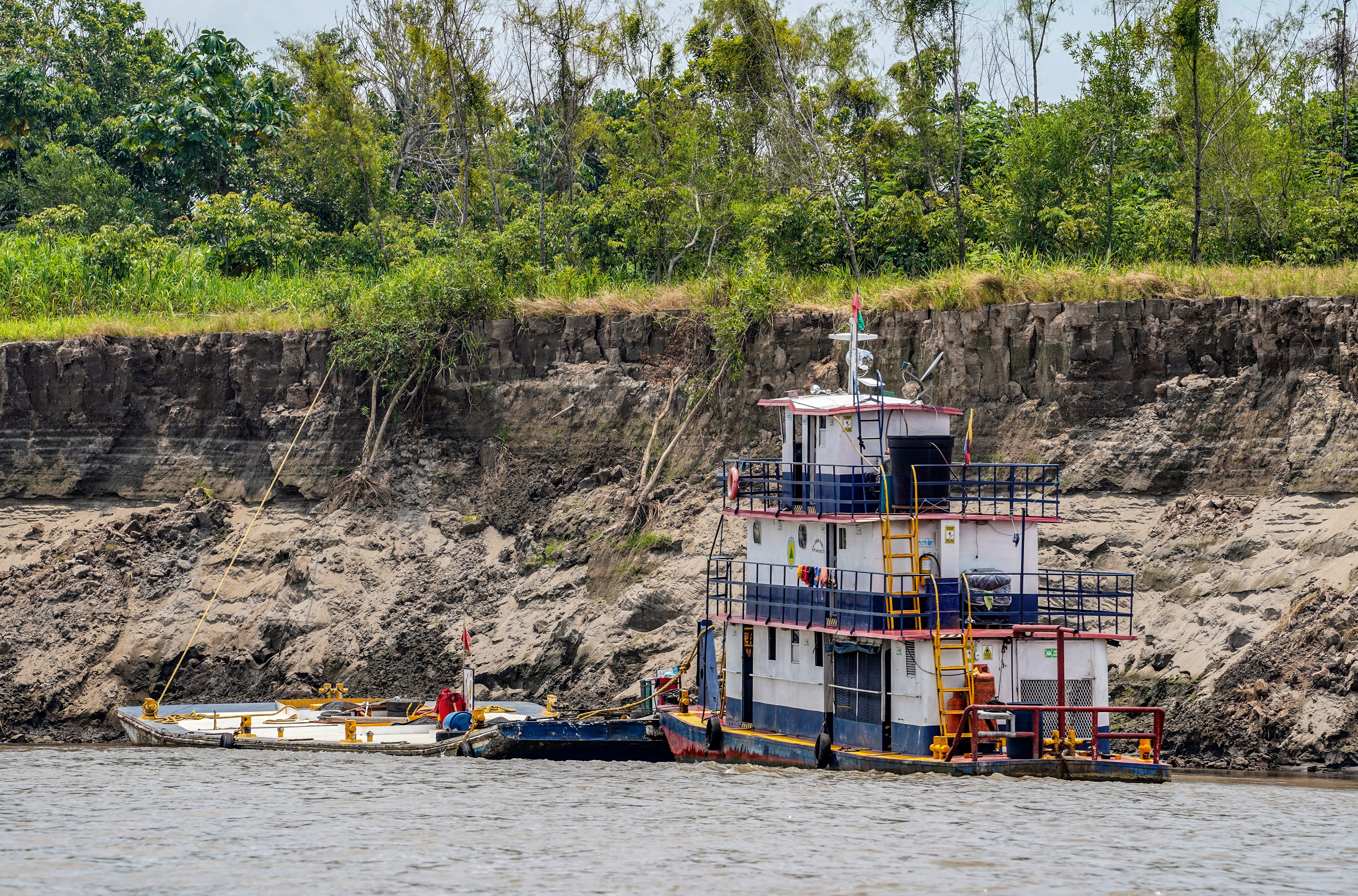 Boats are seen at the Amazon River in the city of Leticia, Amazonas department, on September 15, 2024