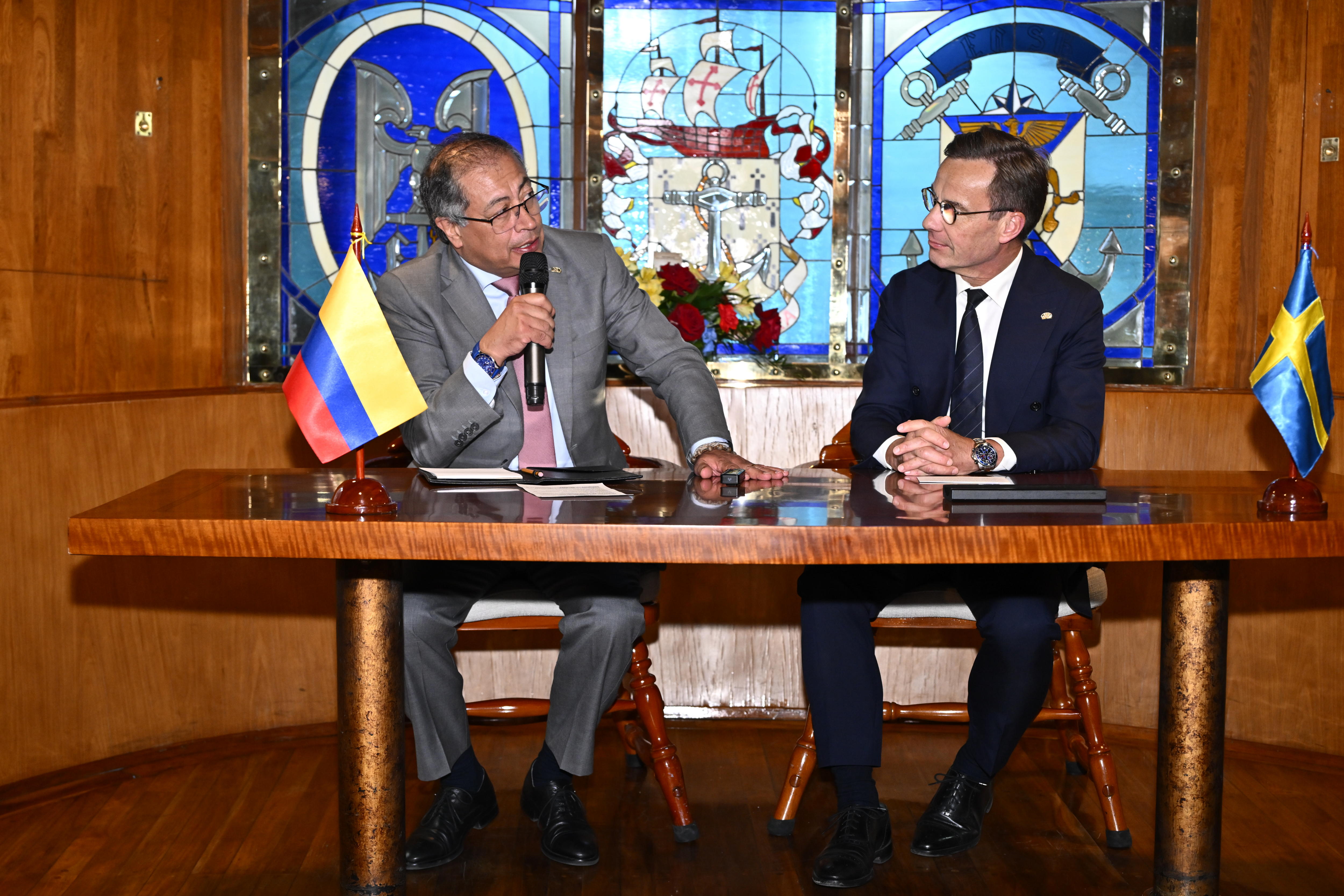 Aboard Arc Gloria (Colombia), 13/06/2024.- Sweden's Prime Minister Ulf Kristersson (R) listens to Colombian President Gustavo Petro Urrego (L) as they meet for bilateral talks and signing a bilateral partnership, aboard the Colombian navy's flagship 'ARC Gloria', which is docked at the Skeppsbron during the Colombian president's visit to Sweden, in Stockholm, 13 June 2024. The Colombian President is on an official visit in Sweden from 11 to 14 June on the occasion of marking the 150th anniversary of bilateral relations between the two countries. The visit is focussed on 'bilateral relations, multilateral issues, the peace process in Colombia, sustainable development, research and innovations and economic cooperation', the Swedish Parliament says on its website. (Suecia, Estocolmo) EFE/EPA/Anders Wiklund SWEDEN OUT