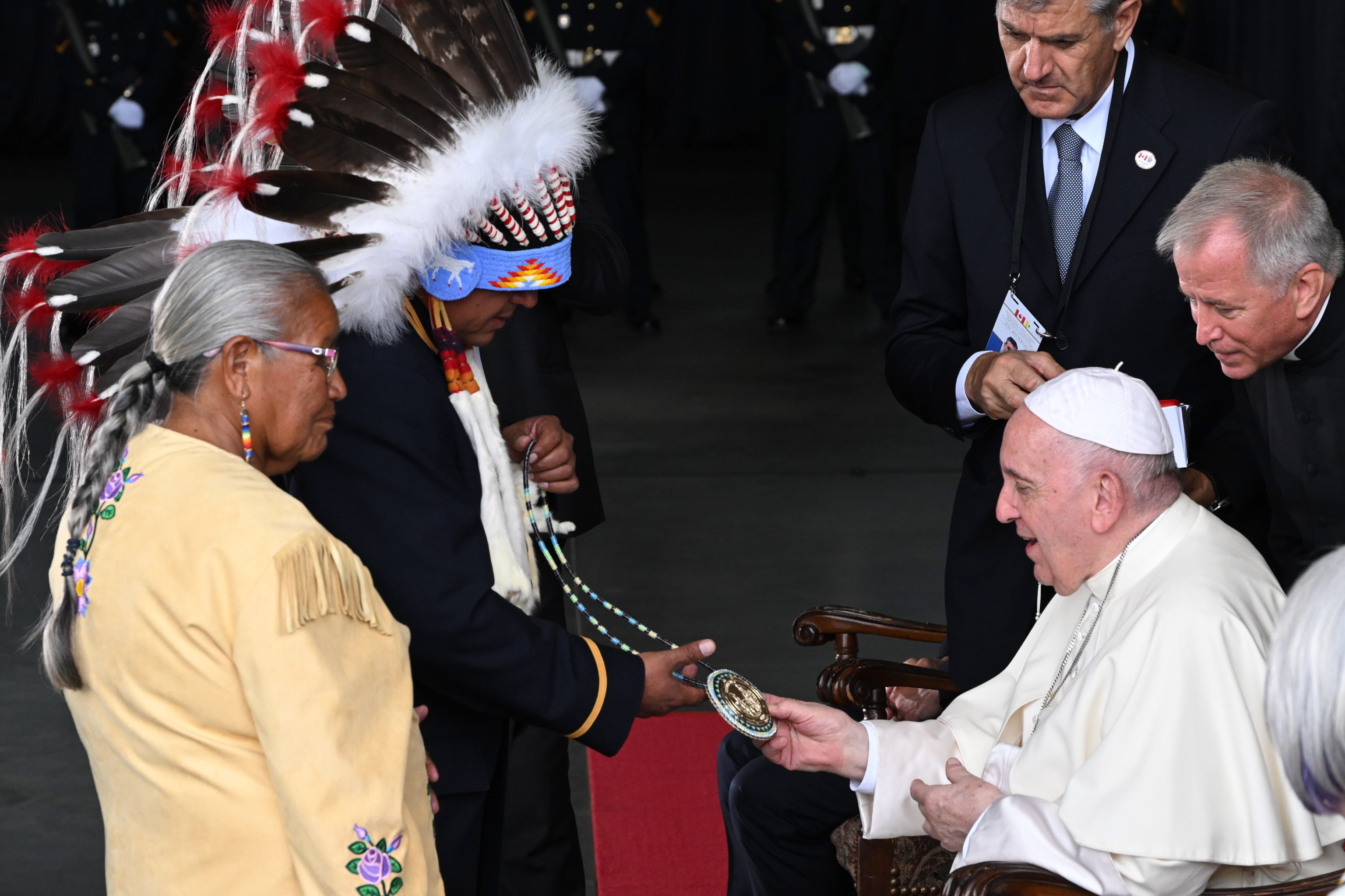 Edmonton (Canada), 24/07/2022.- Pope Francis meets members of an indigenous tribe during his welcoming ceremony at Edmonton International Airport in Alberta, western Canada, 24 July 2022. The five-days visit is the first papal visit to Canada in 20 years. (Papa) EFE/EPA/CIRO FUSCO
