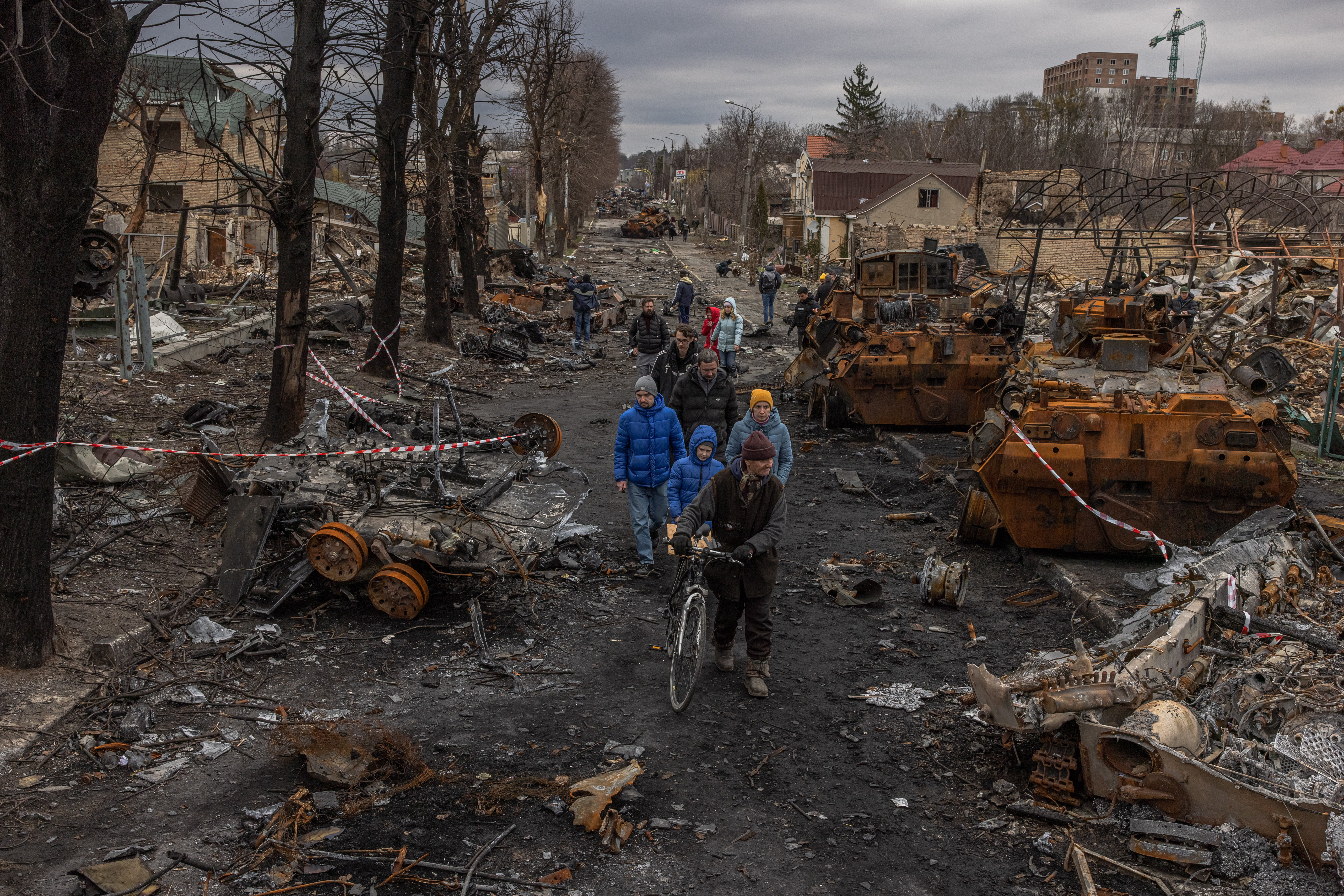 Bucha (Ukraine), 06/04/2022.- (FILE) - Residents walk past destroyed Russian military machinery on the street, in Bucha, the town which was retaken by the Ukrainian army, northwest of Kyiv, Ukraine, 06 April 2022. (Issued on 21 February 2023). Russian troops on 24 February 2022, entered Ukrainian territory, starting a conflict that has provoked destruction and a humanitarian crisis. One year on, fighting continues in many parts of the country. (Rusia, Ucrania) EFE/EPA/ROMAN PILIPEY ATTENTION: This Image is part of a PHOTO SET