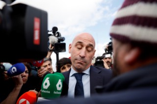 Former president of the Spanish football federation Luis Rubiales, accused of sex assault and coercion over forcible kiss, is surrounded by media as he leaves after taking the stand during his trial at the court of San Fernando de Henares, east of Madrid, on February 11, 2025.
