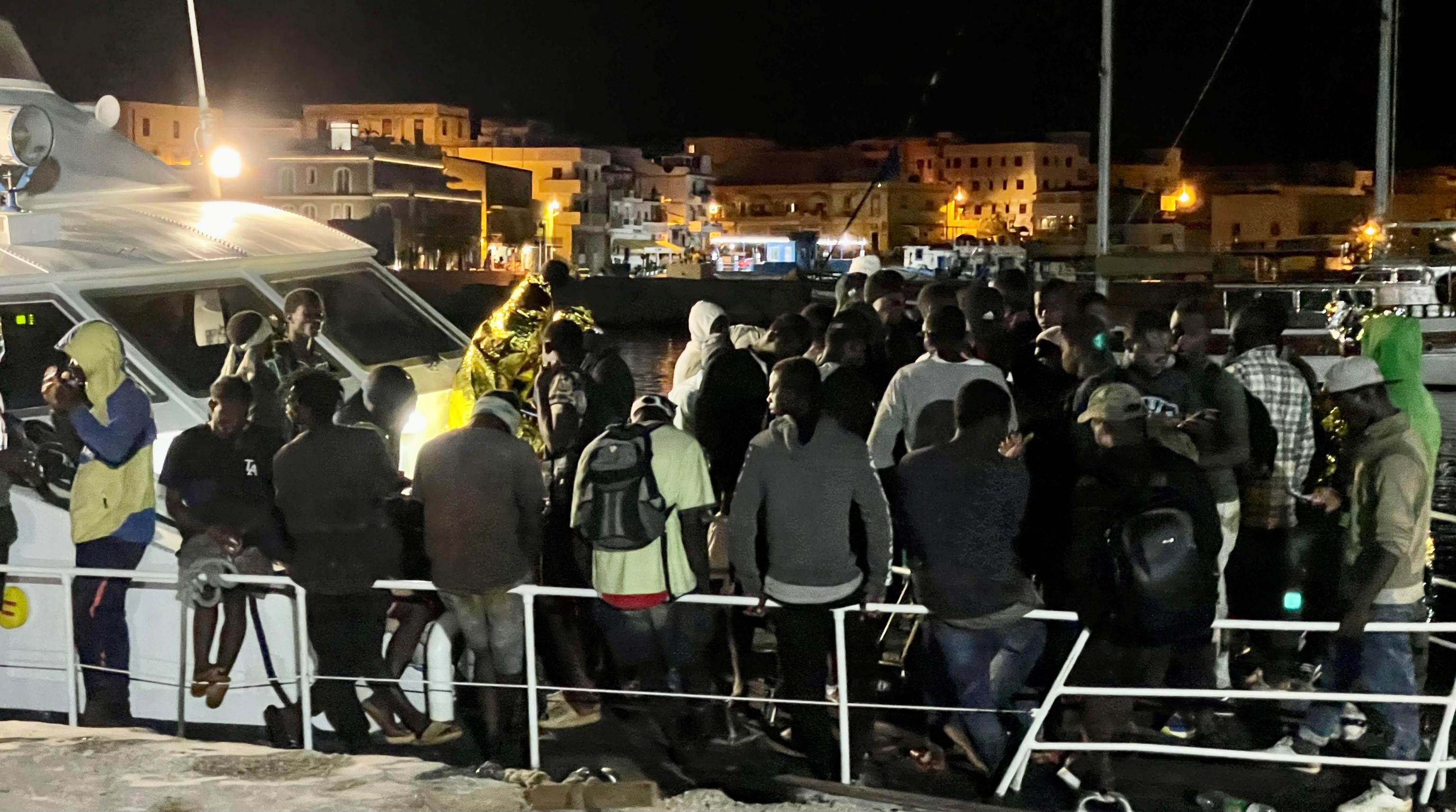 Lampedusa (Italy), 11/08/2023.- Migrants disembark from a patrol boat at a commercial port of Lampedusa (Agrigento), southern Italy, 10 August 2023 (issued 11 August 2023), as some 340 migrants were rescued and taken to the Sicilian island. The European Border and Coast Guard Agency (Frontex) said on 11 August that the number of illegal arrivals to the EU via the Central Mediterranean migrant route between North Africa and Italy, which 'remains the main migratory route into the EU', rose by 115 percent to 89,000 in the first seven months of 2023, adding that it is the highest total on this route for this period since 2017. (Italia) EFE/EPA/ELIO DESIDERIO