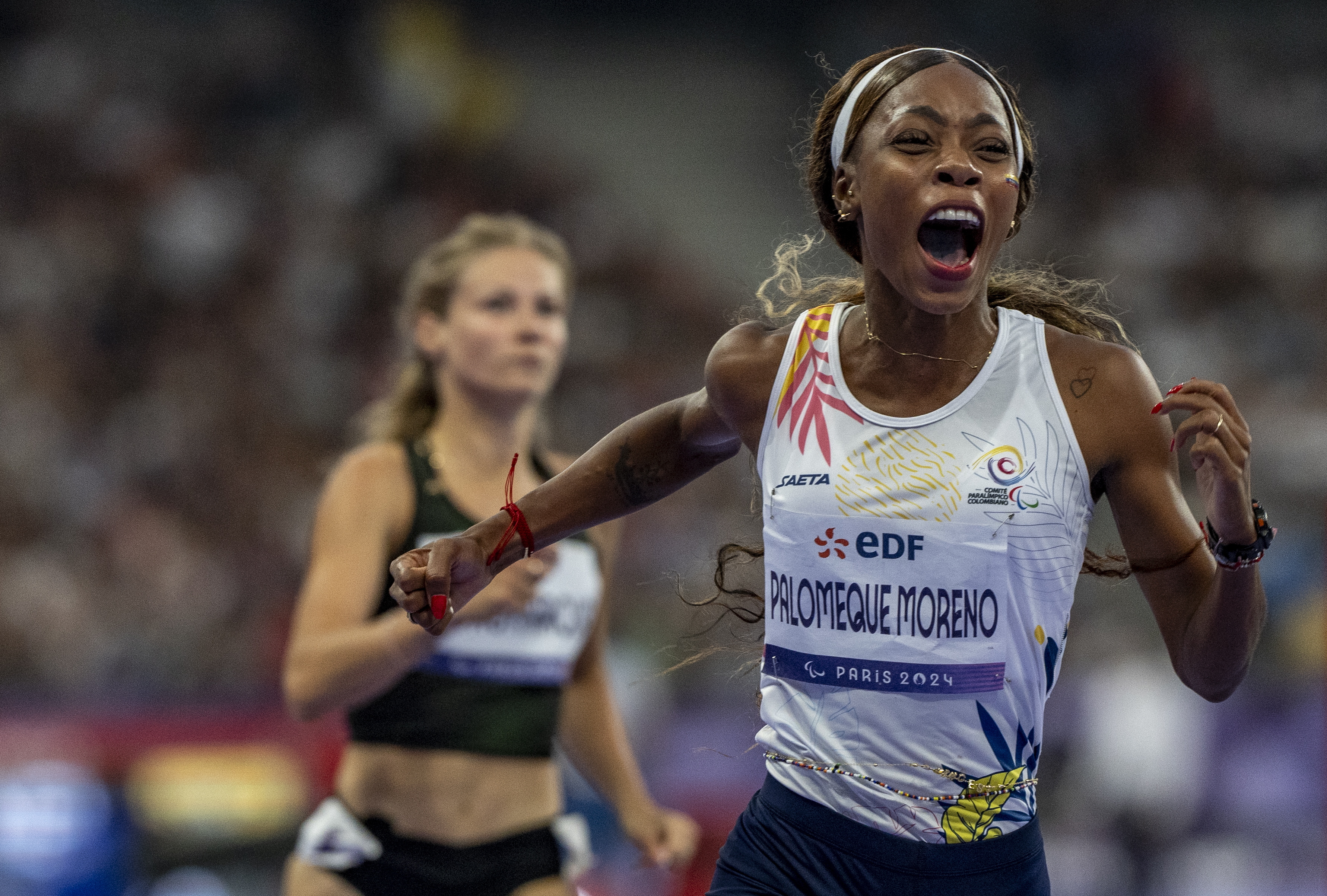 Paris (France), 31/08/2024.- Karen Tatiana Palomeque Moreno of Colombia celebrates winning the Para Athletics Women'Äôs 100m - T38 Final at the Stade de France at the Paris 2024 Paralympic Games, in Paris, France, 31 August 2024. (100 metros, Francia) EFE/EPA/Jeremy Davis for OIS/IOC HANDOUT EDITORIAL USE ONLY/NO SALES