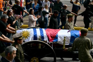 The funeral cortege of Uruguay's former President Jose 'Pepe' Mujica makes its way in downtown Montevideo, on May 14, 2025, a day after his death.
